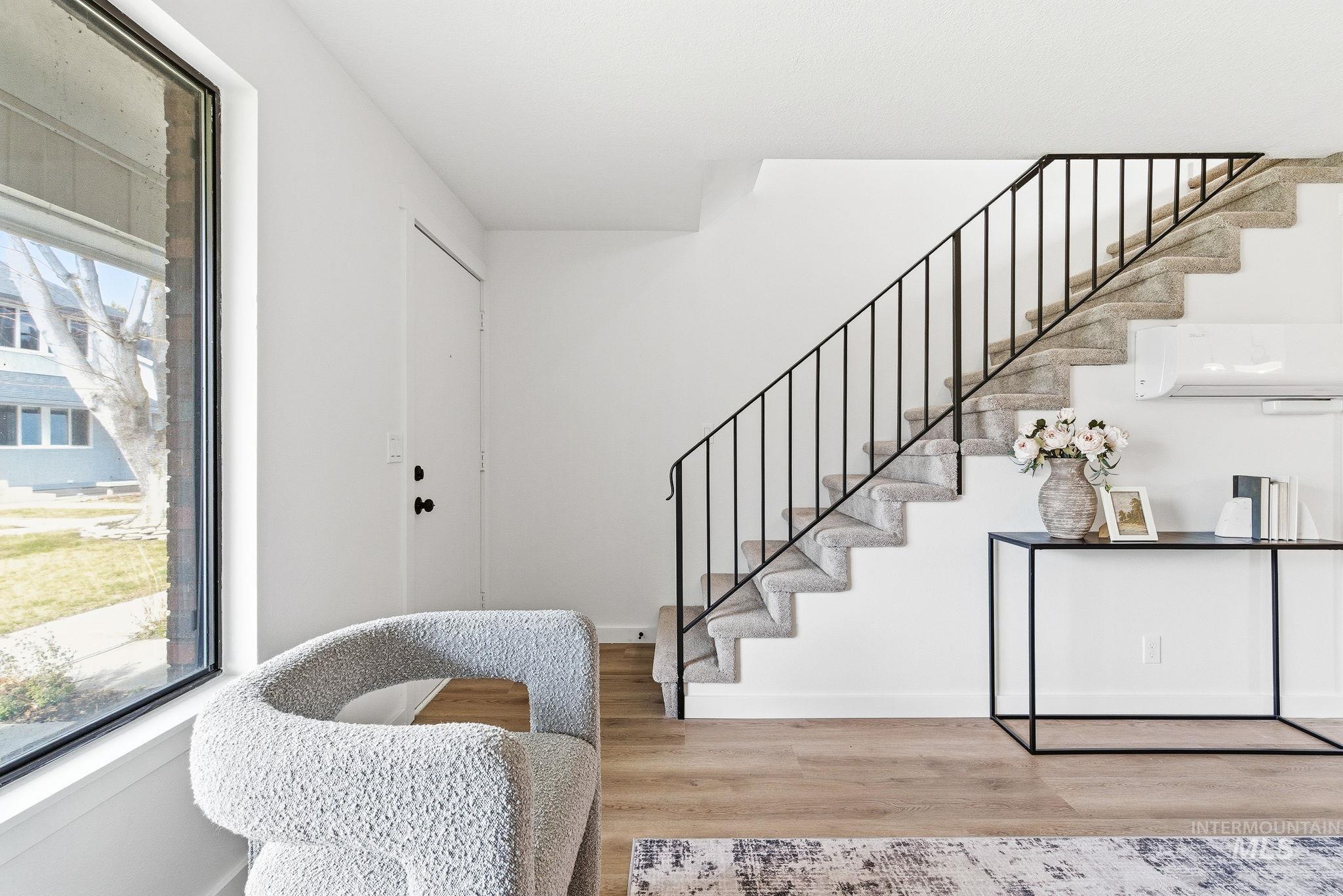 Entrance foyer with stairway and light wood-type flooring