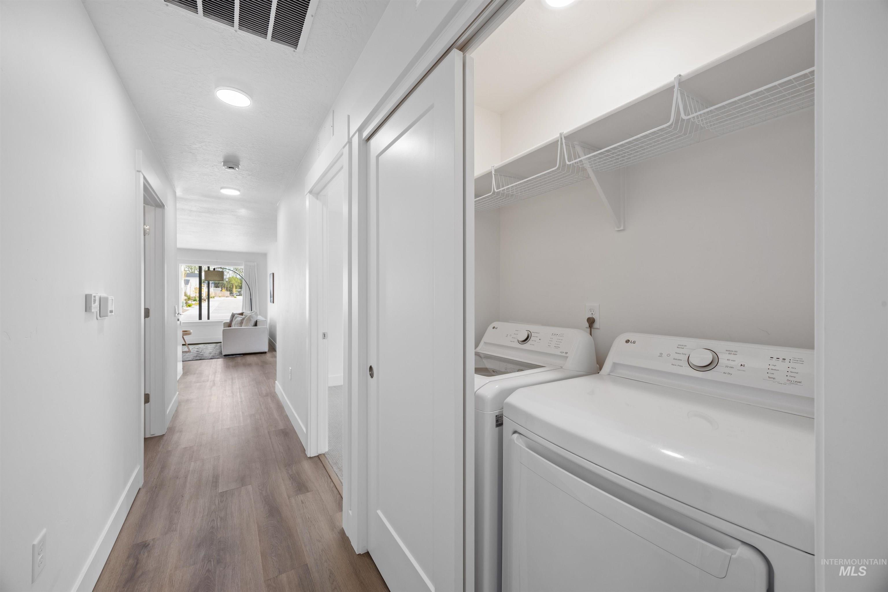 Dedicated laundry closet with wire shelving