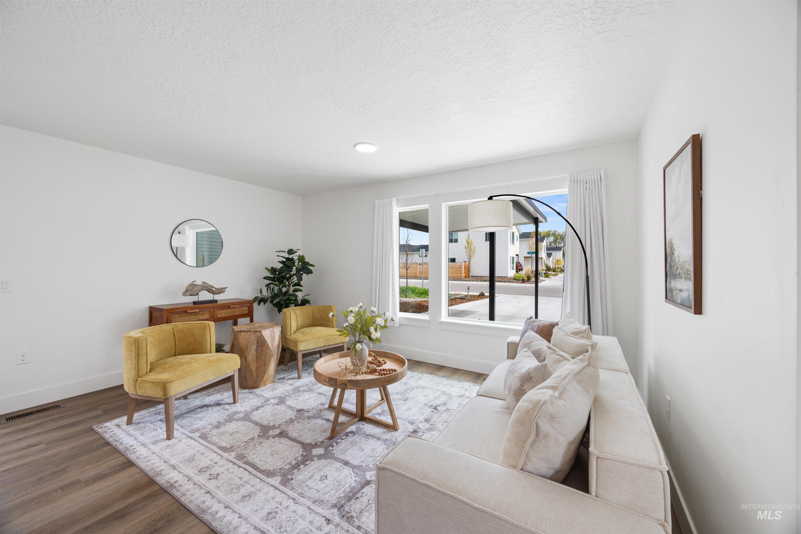 Living room with wood finished floors and baseboards