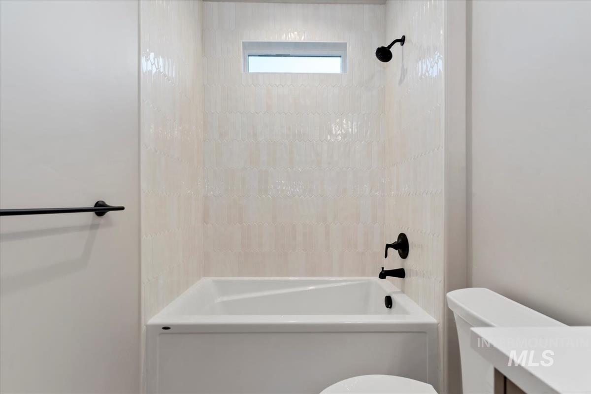 Full bathroom with vanity and shower / bath combination