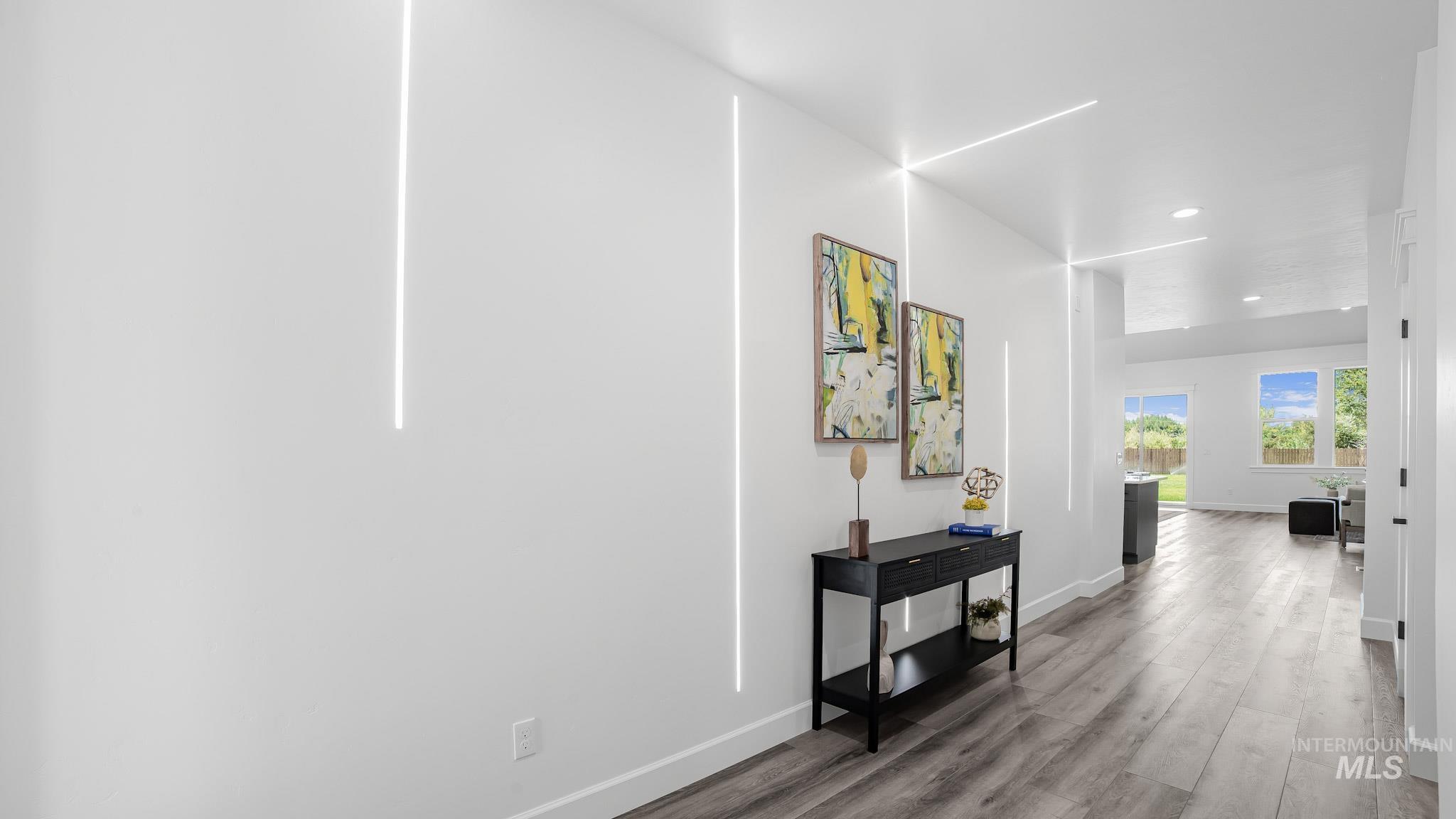 Hallway featuring wood finished floors and recessed lighting