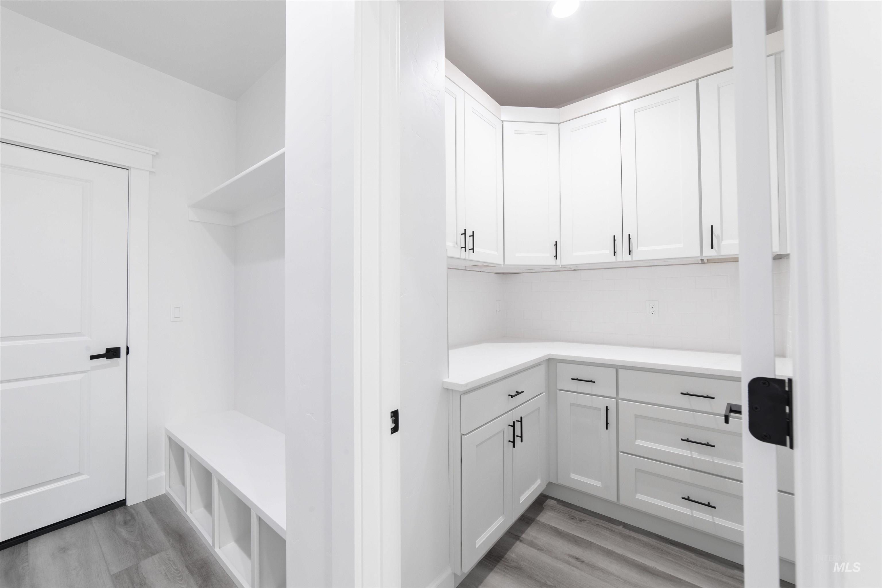 Mudroom featuring light wood-style floors