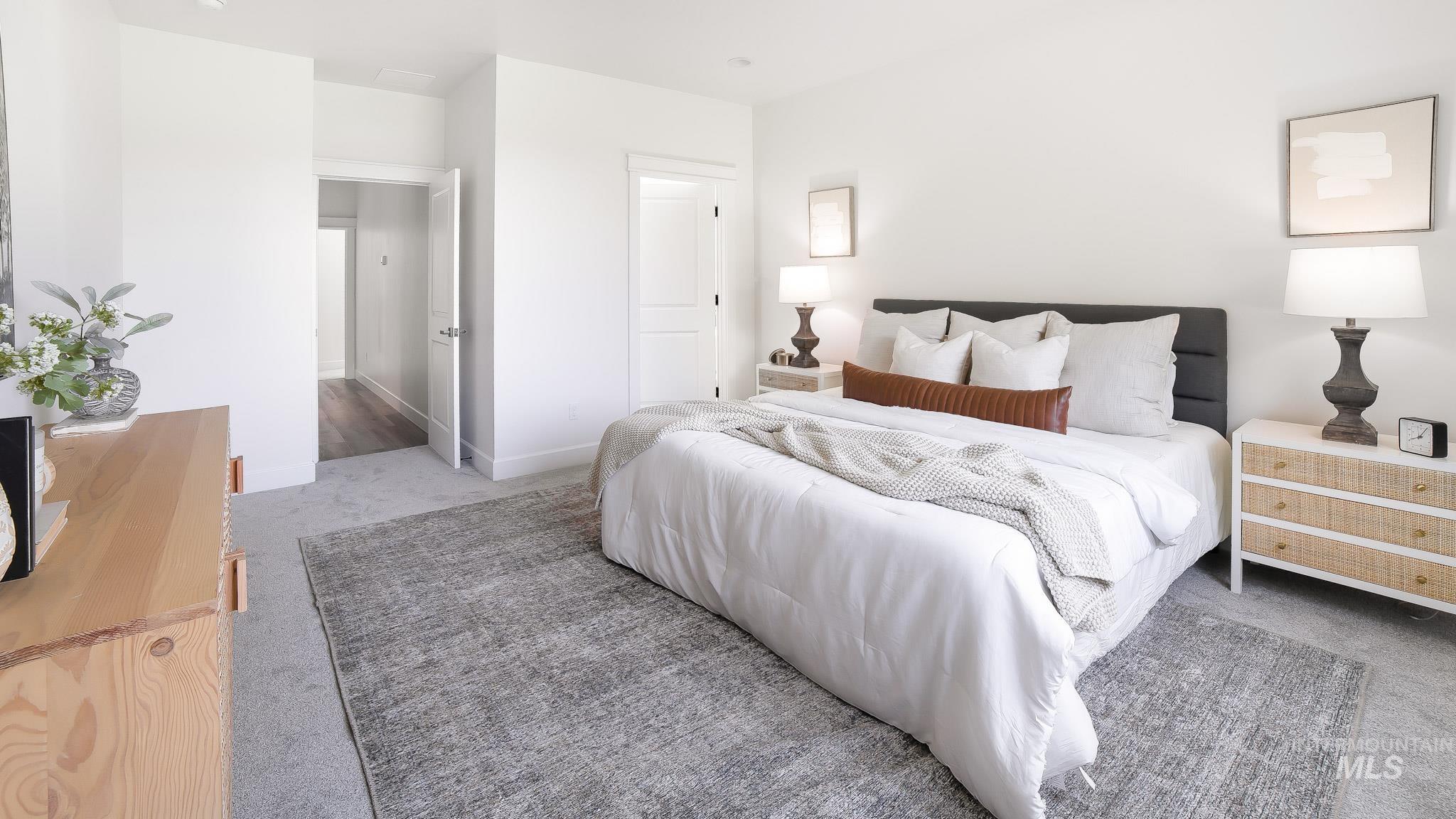 Bedroom featuring carpet flooring and baseboards