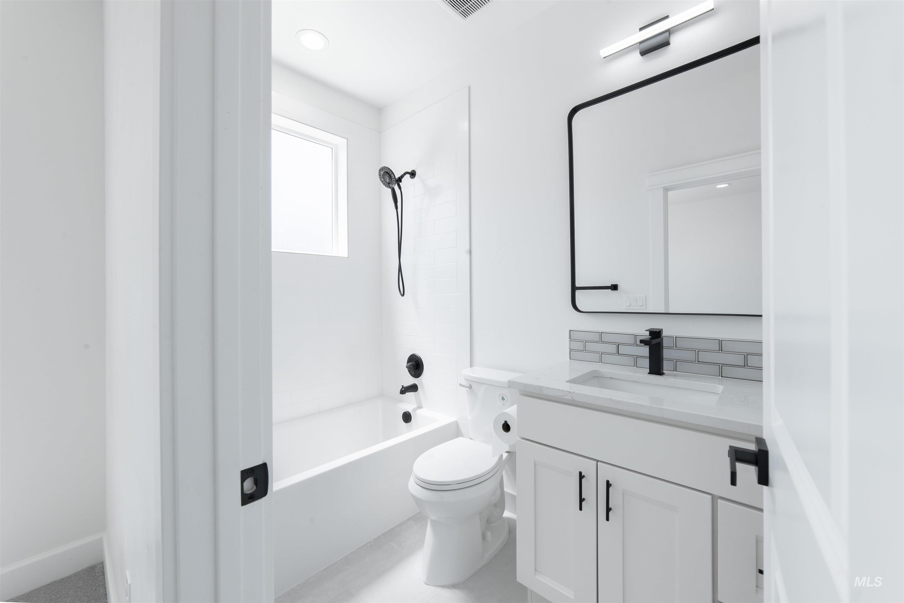 Full bathroom with vanity and bathtub / shower combination