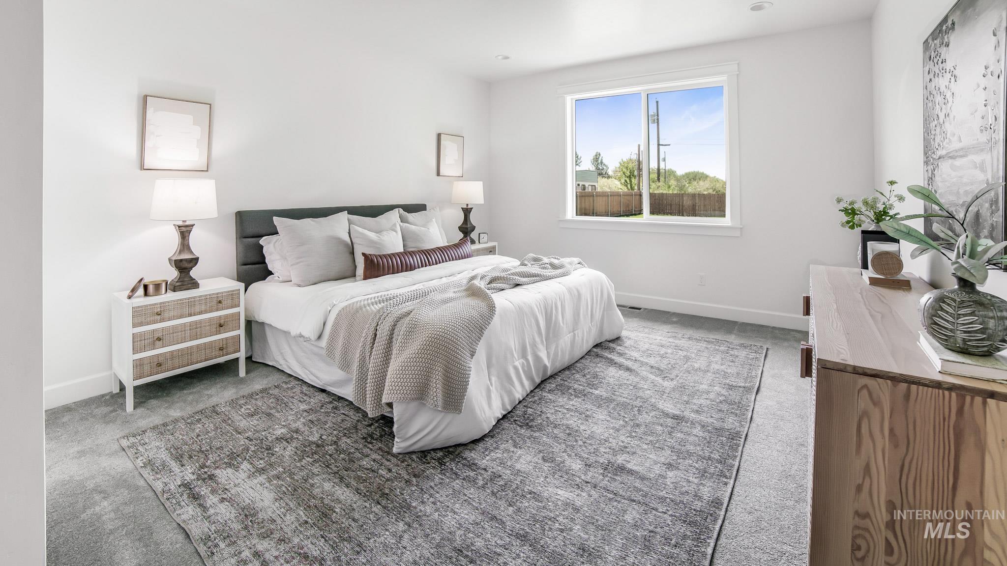 Carpeted bedroom with baseboards