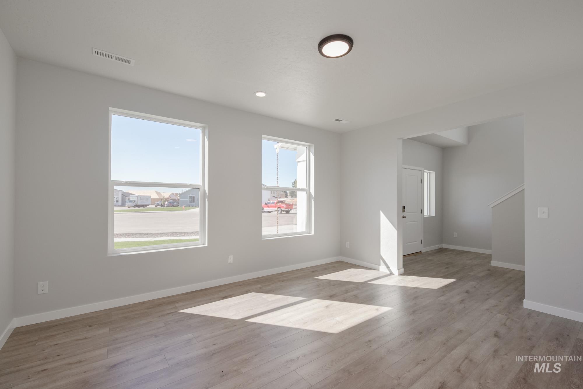 Empty room featuring light wood-style flooring