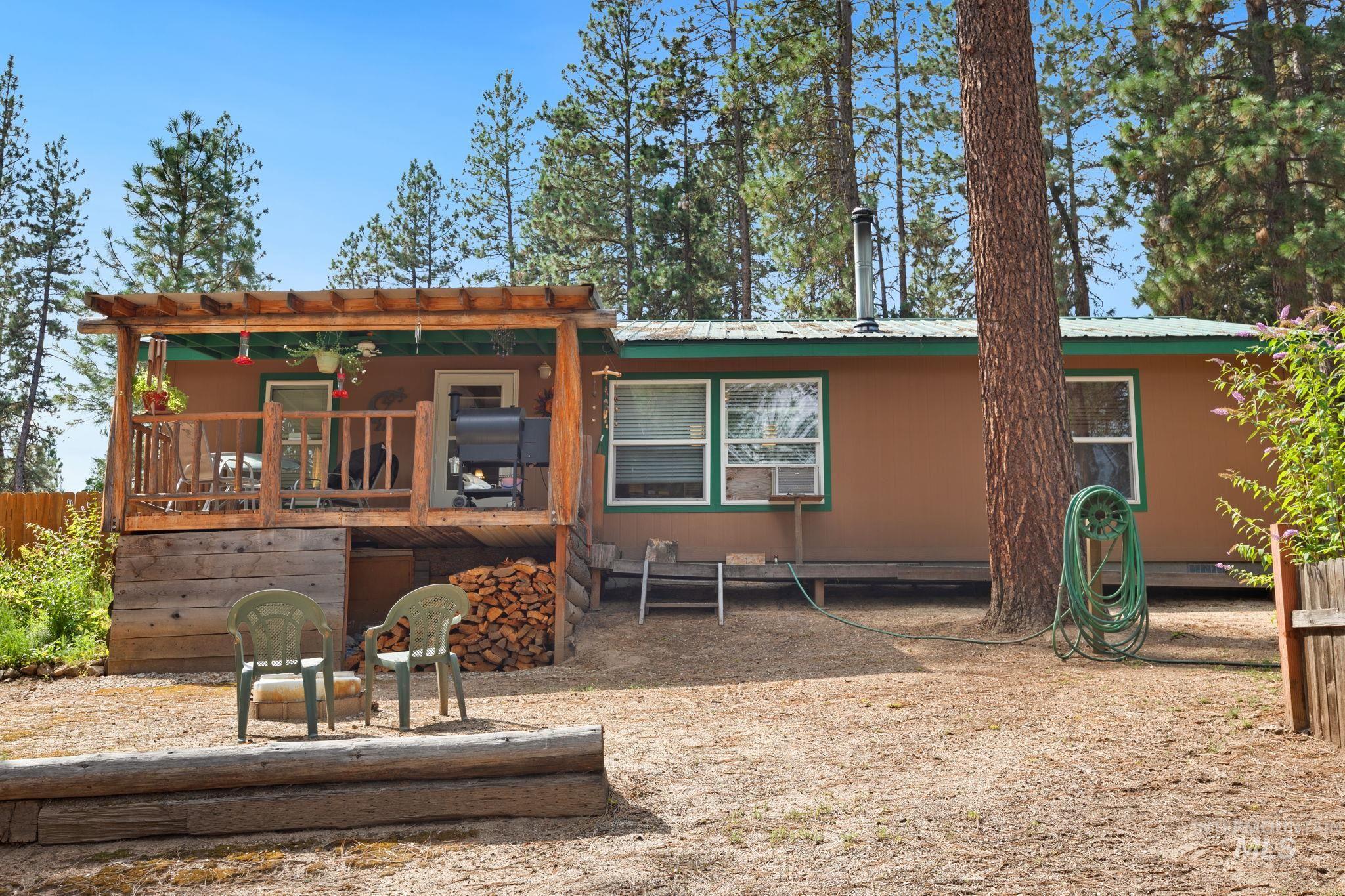 Back of house with a metal roof