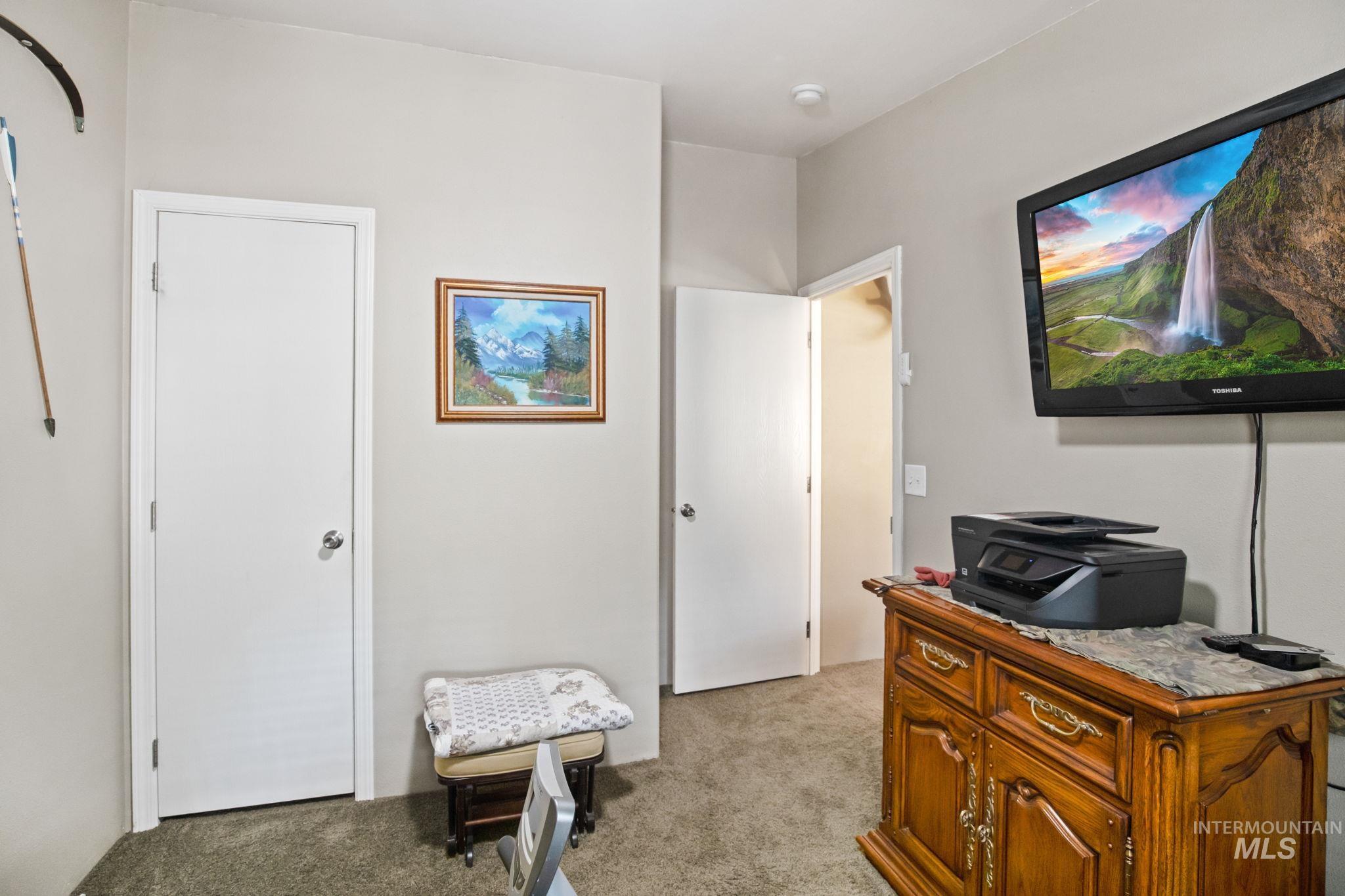 Office area featuring light carpet