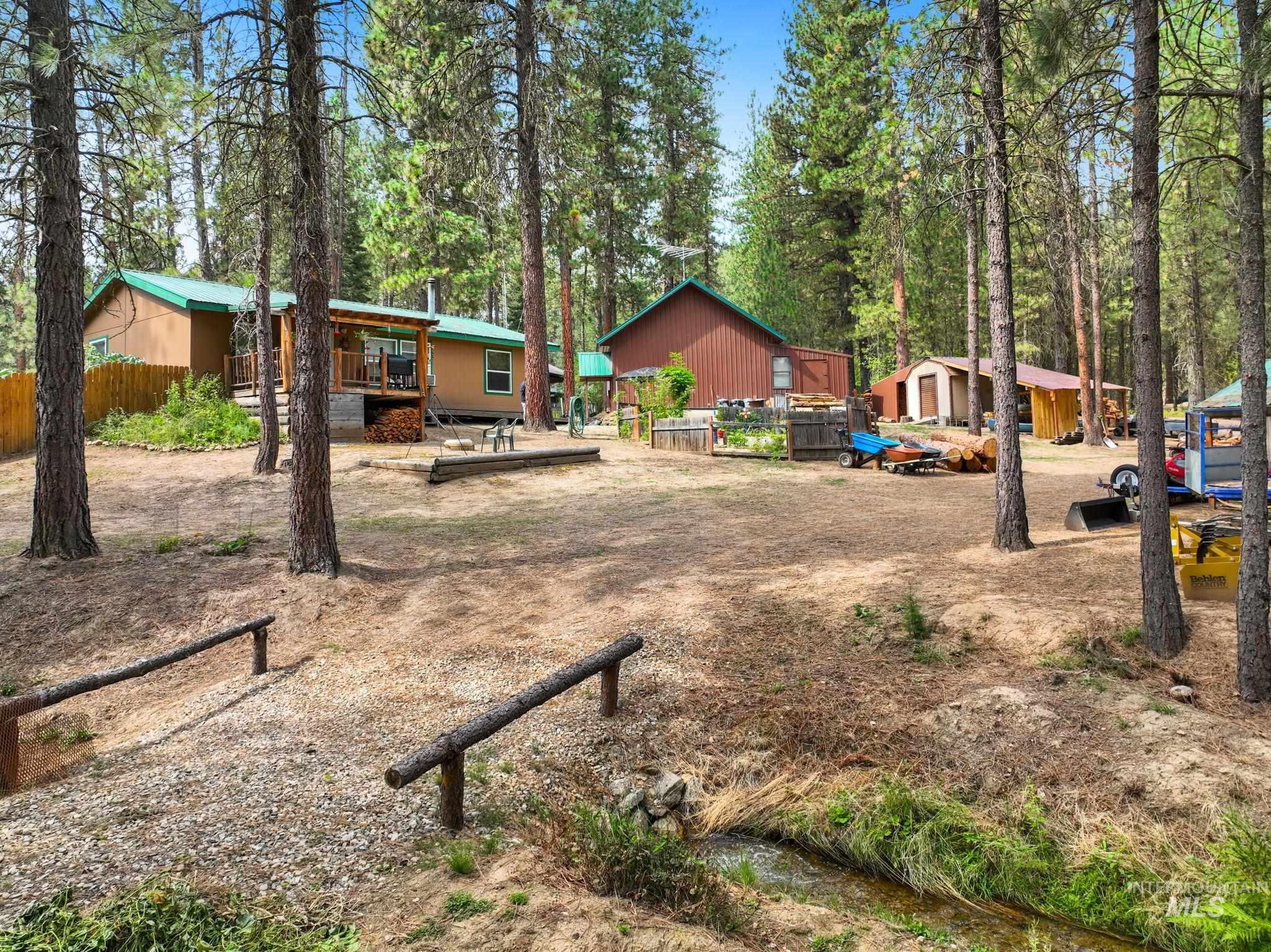 View of yard with a wooden deck and an outbuilding