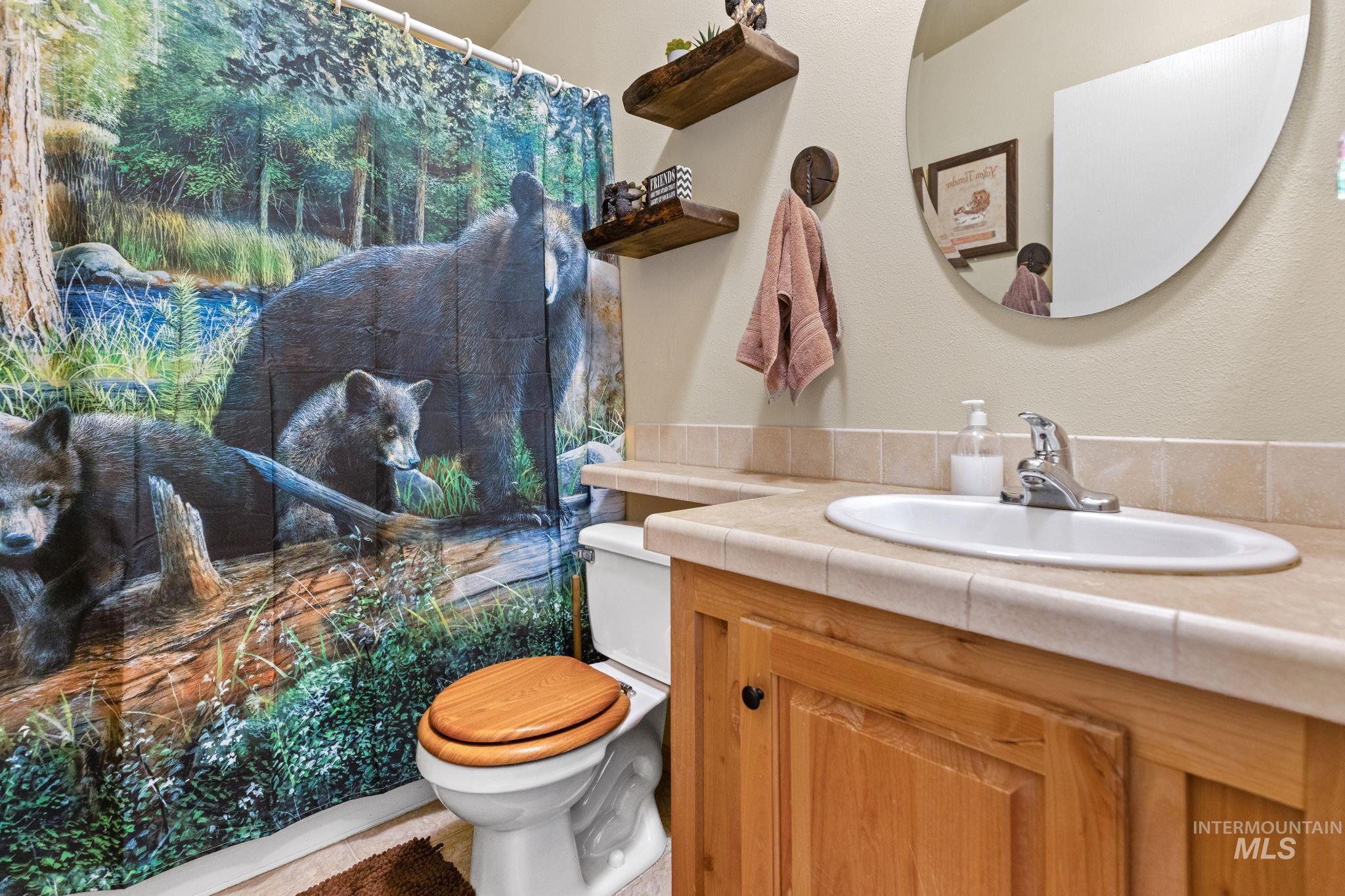 Full bathroom featuring vanity and toilet