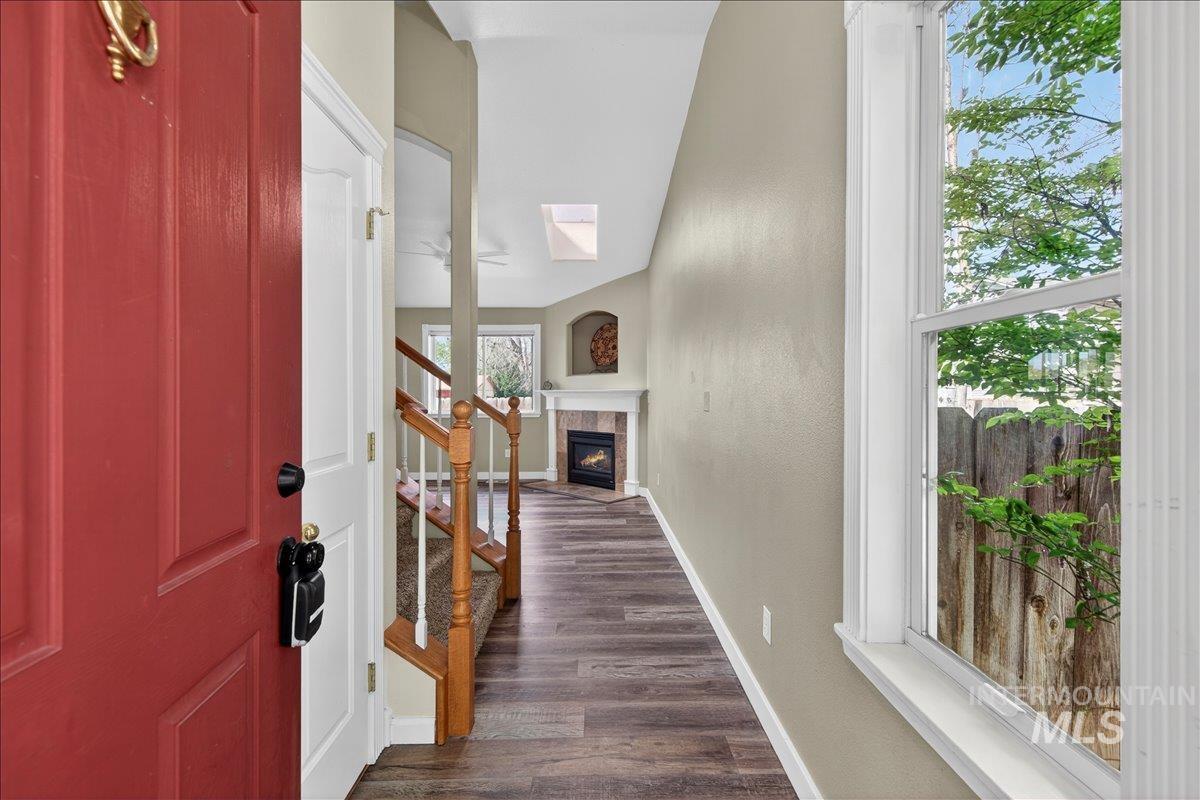 Entryway featuring a fireplace and dark wood finished floors