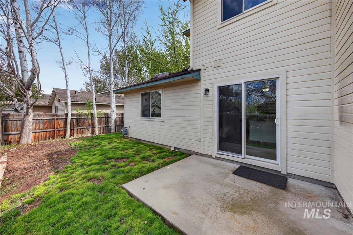 Fenced yard with a patio area
