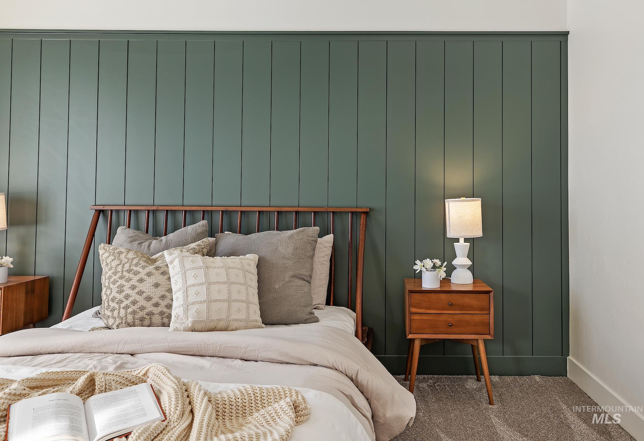 Carpeted bedroom featuring baseboards