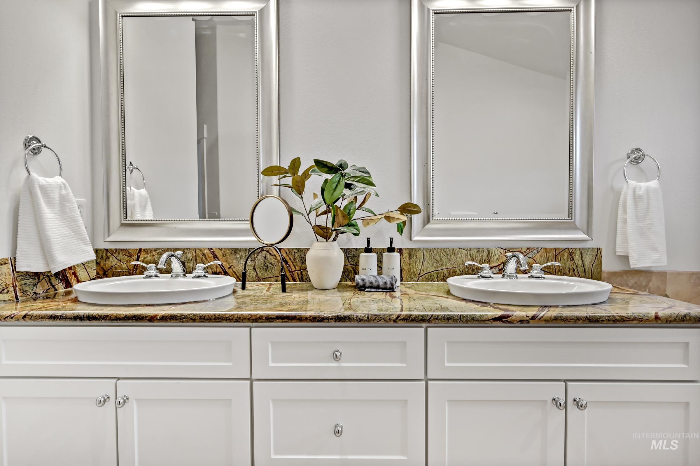 Ensuite bathroom with dual vanity and ample counter space. Bright and well-maintained with clean finishes.
