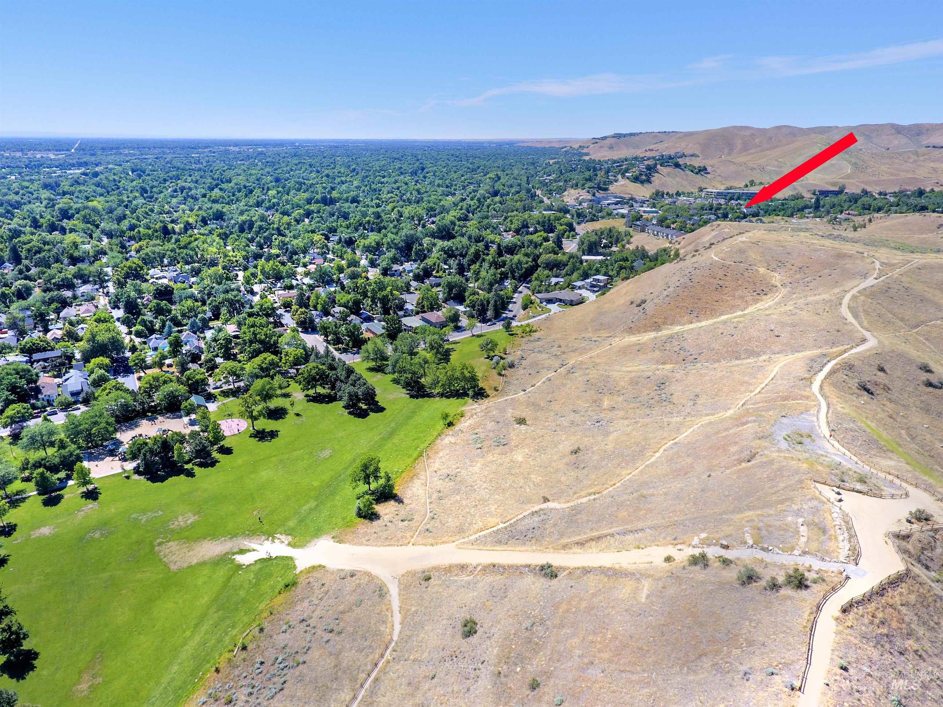 Aerial view of surrounding neighborhood and foothills. Scenic perspective of the area.