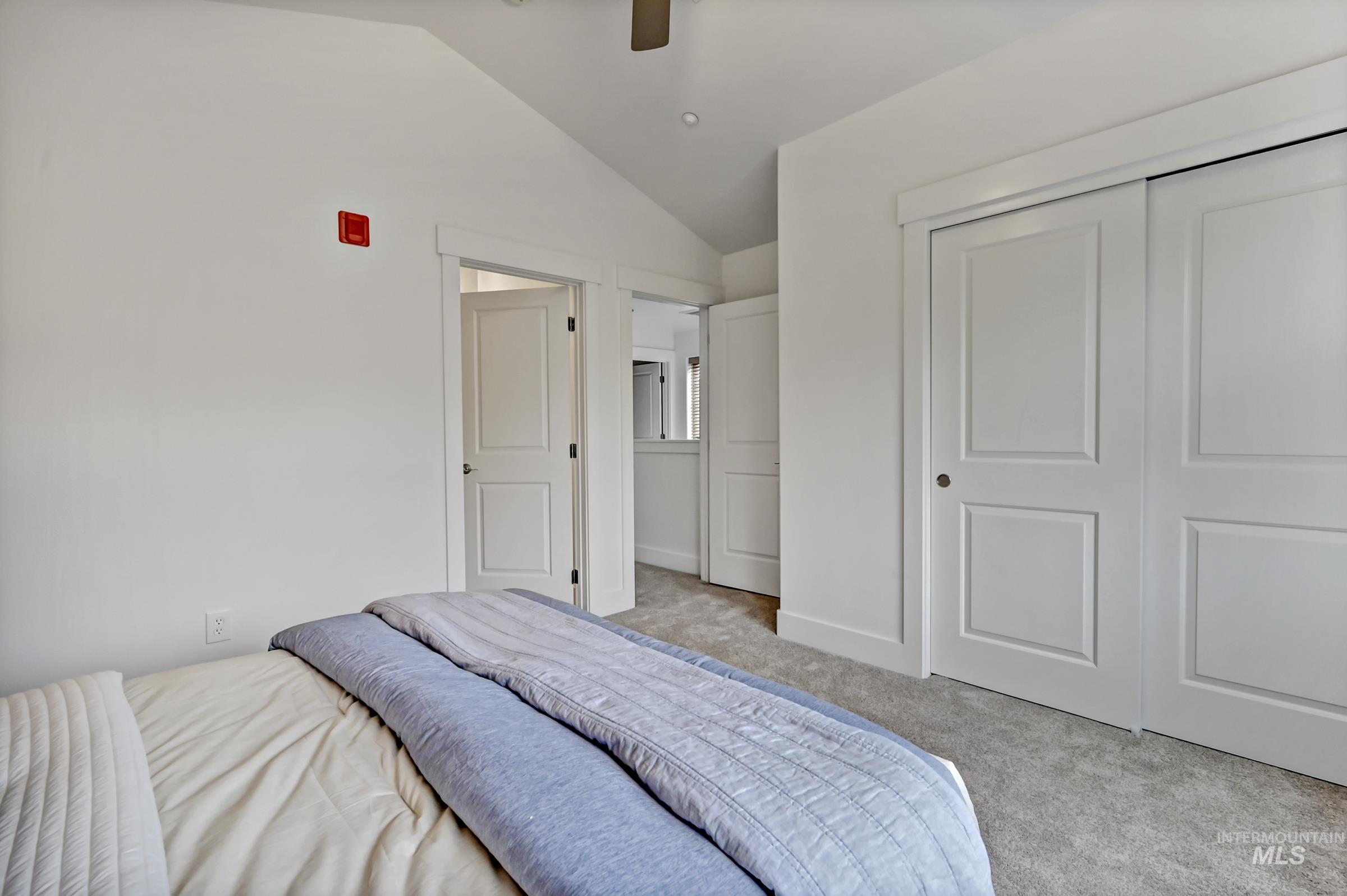 Ensuite bedroom with carpet and natural light. Clean, simple layout for flexible use.