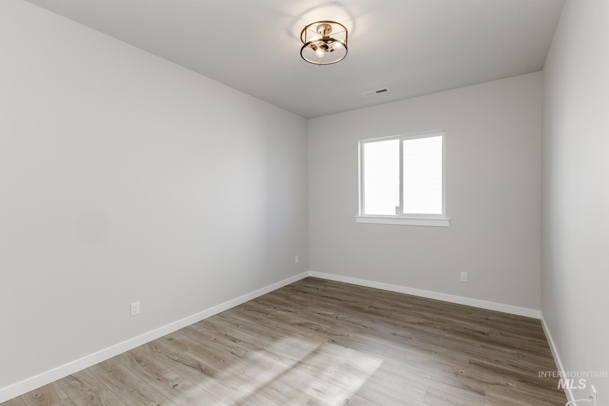 Unfurnished room featuring light wood-style floors