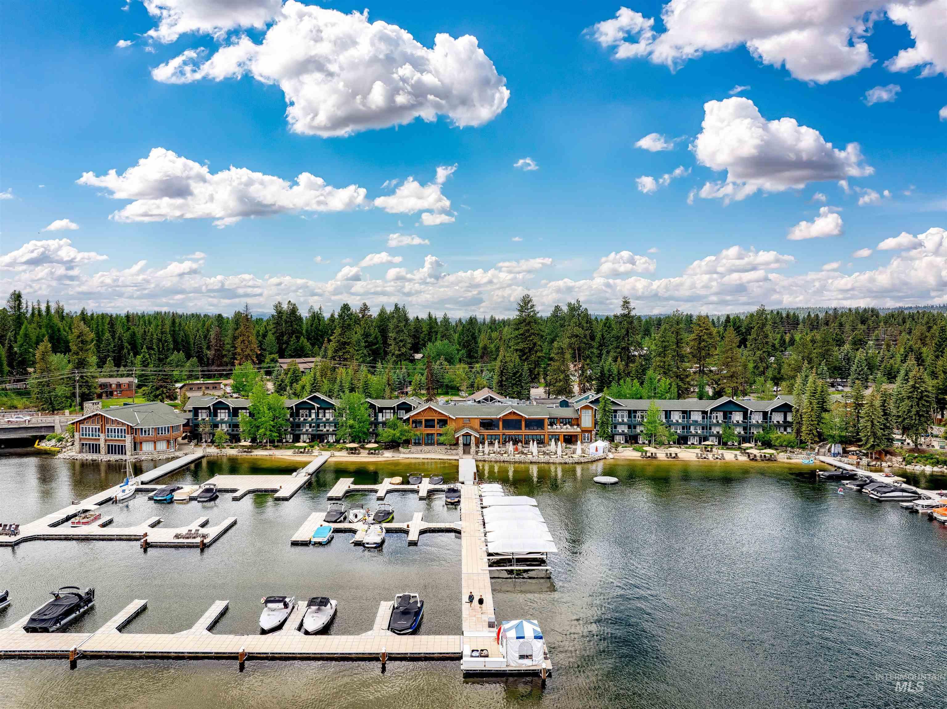 Bird's eye view of a nearby body of water and a heavily wooded area