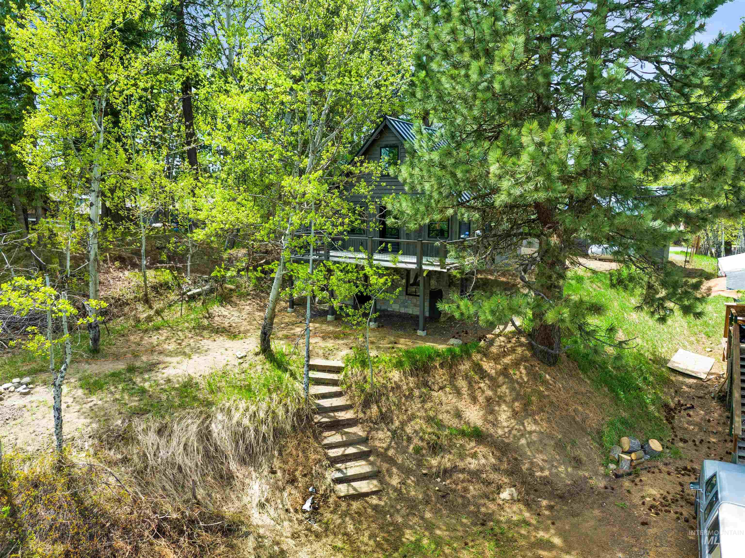 View of yard with stairs and a patio