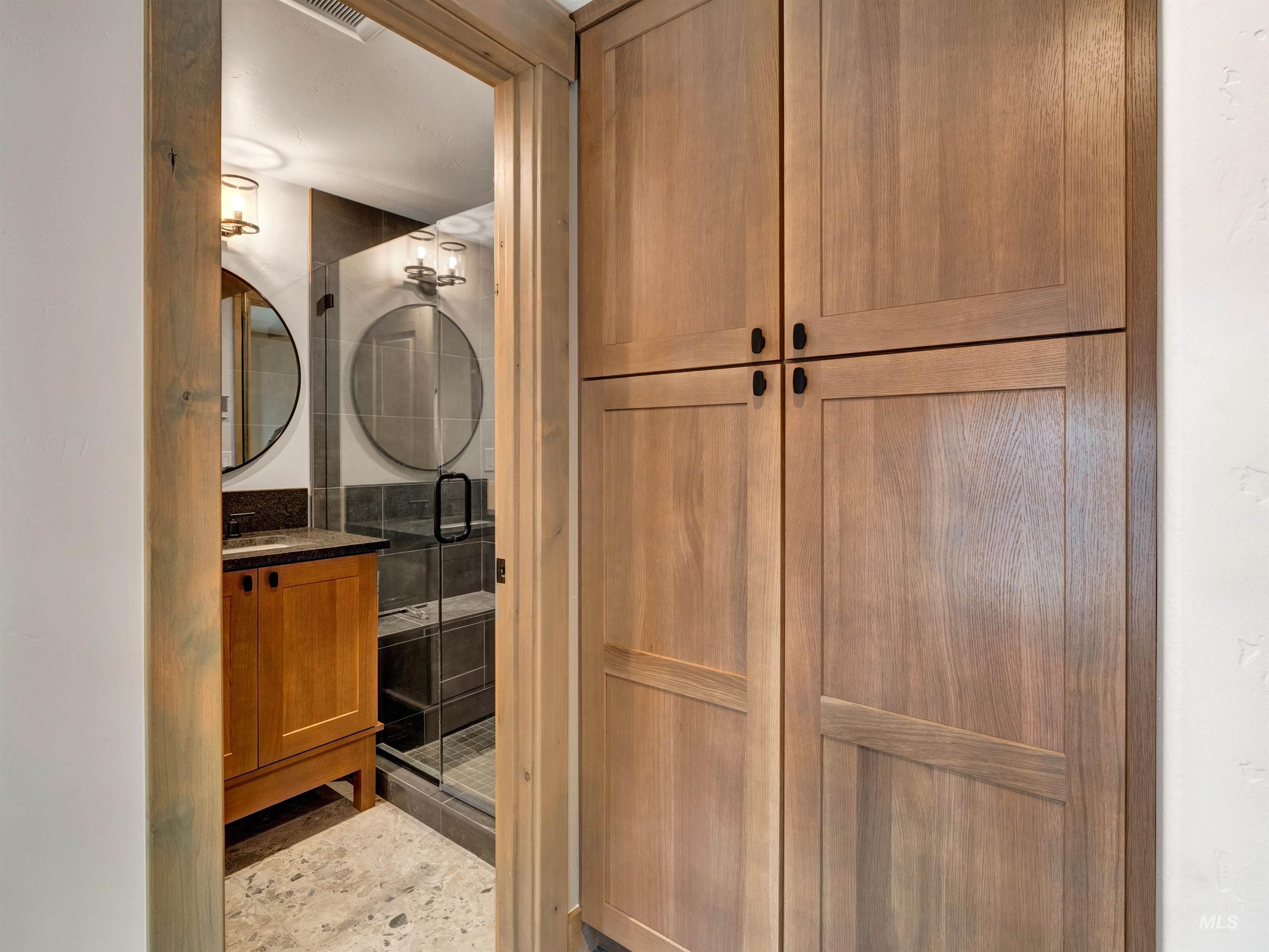 Bathroom with a shower stall and vanity