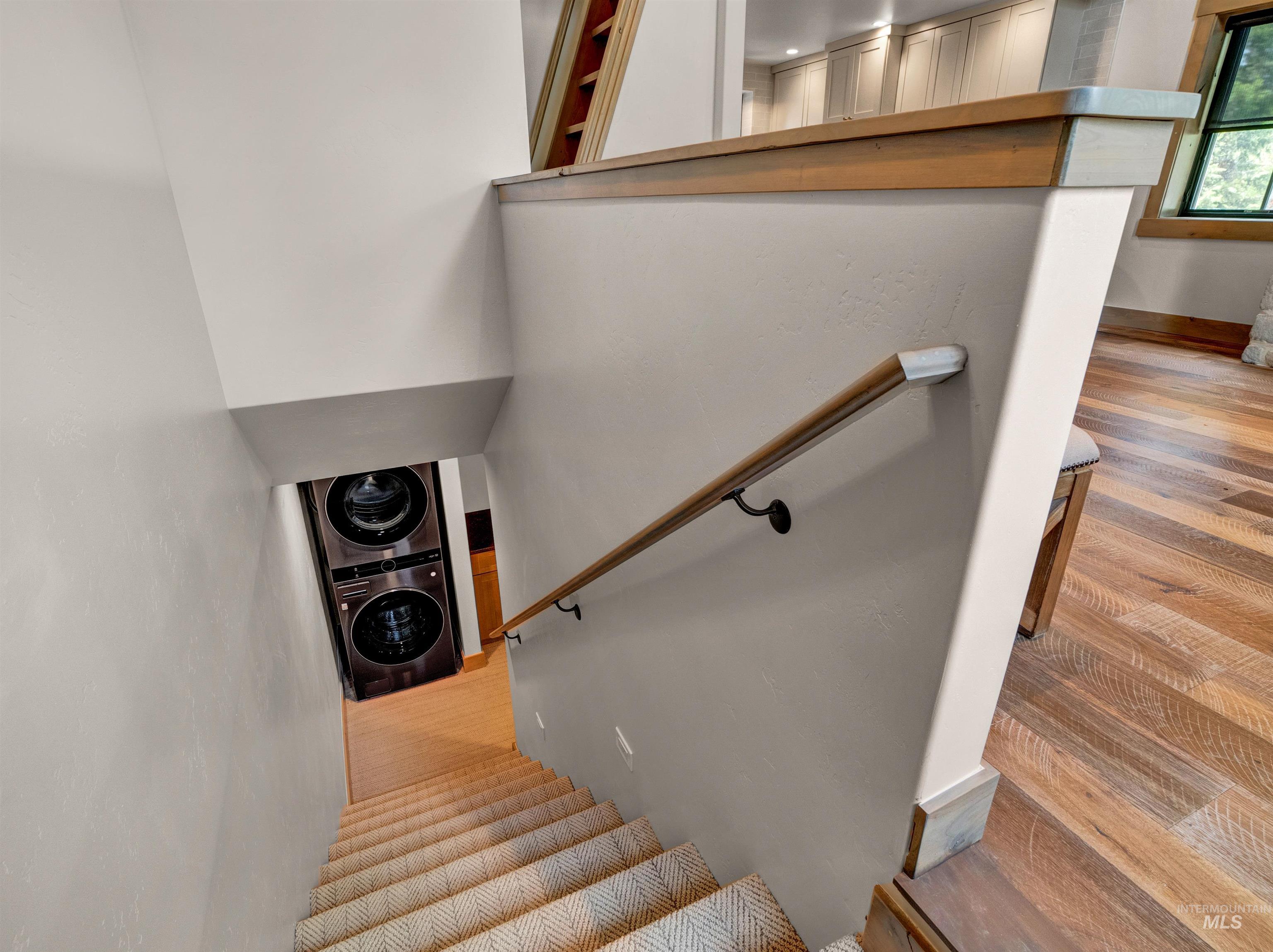 Stairs with stacked washer and dryer