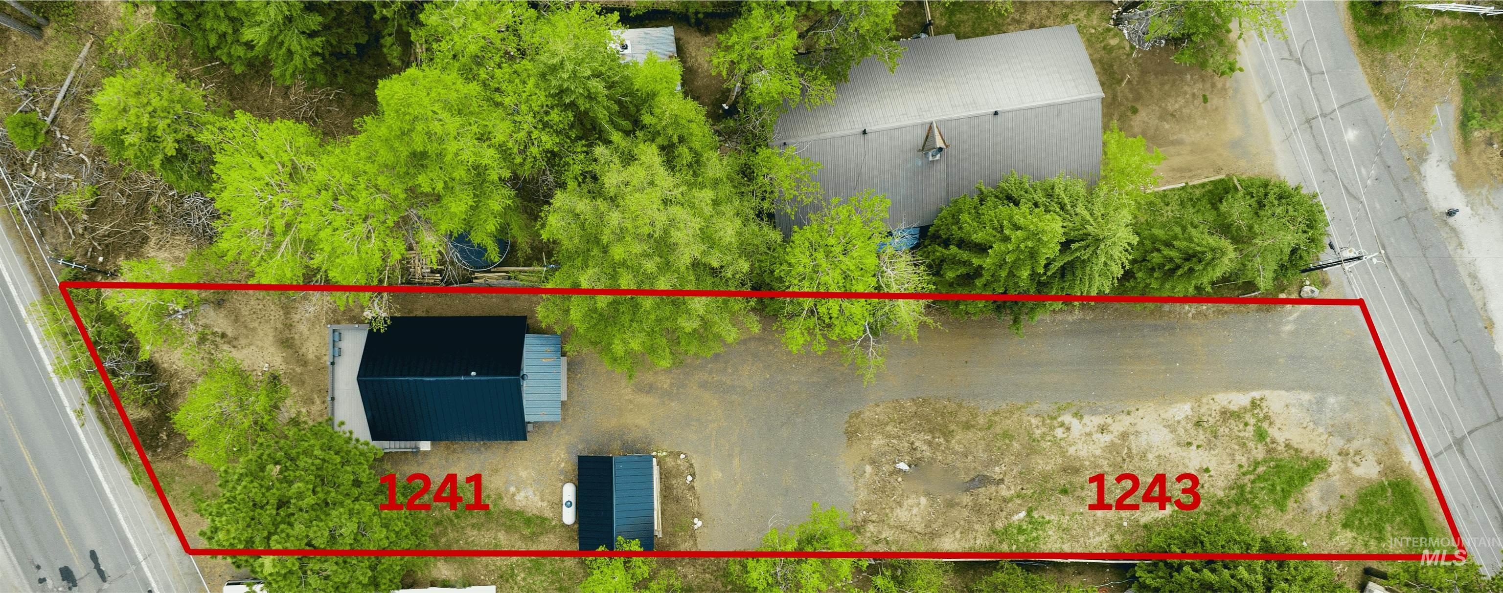 Aerial view of property and surrounding area with property boundaries highlighted