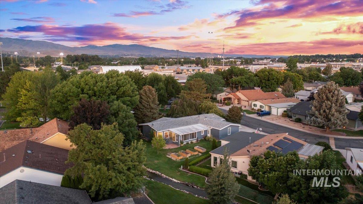 Aerial view at dusk of a mountain view and a residential view