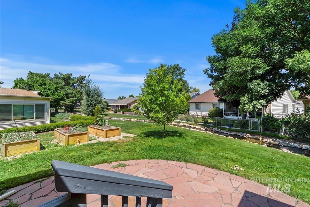 View of yard with a garden and a patio
