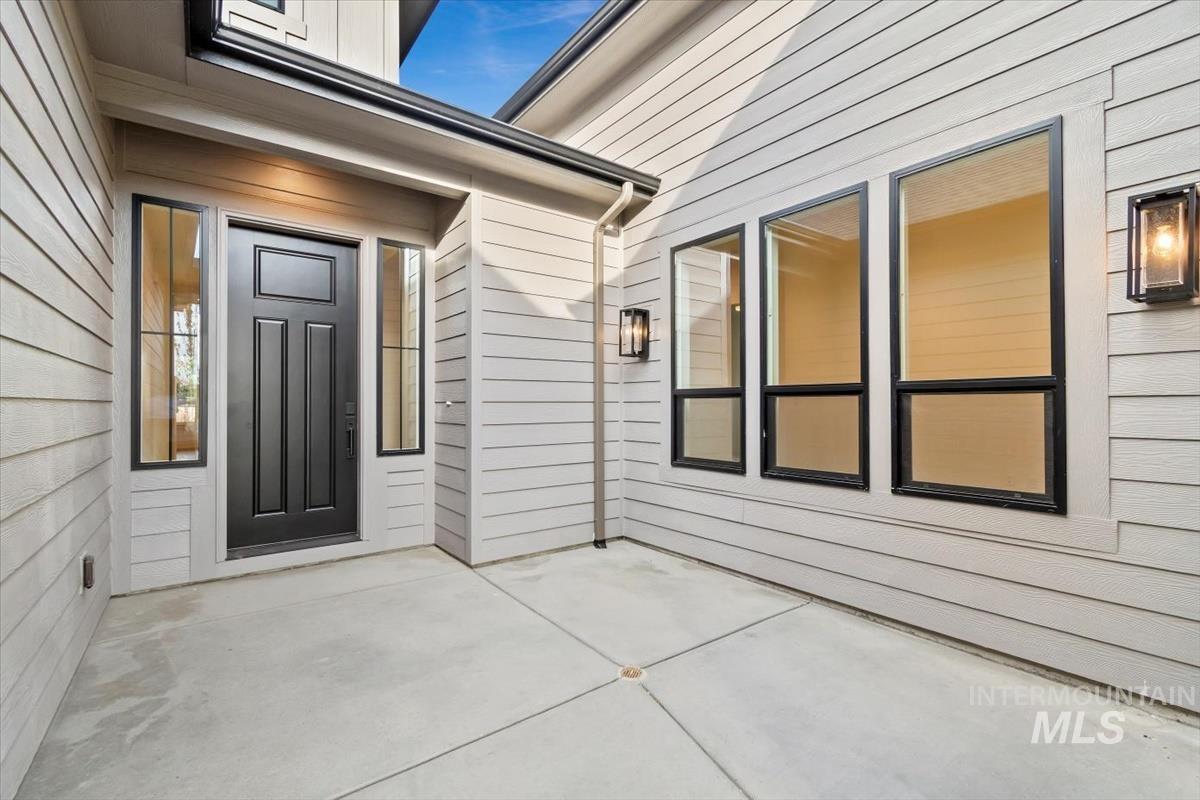 Property entrance featuring a patio area