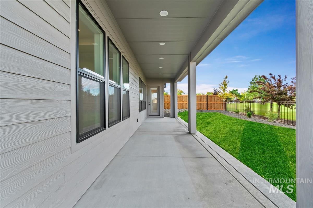 Fenced backyard with a patio