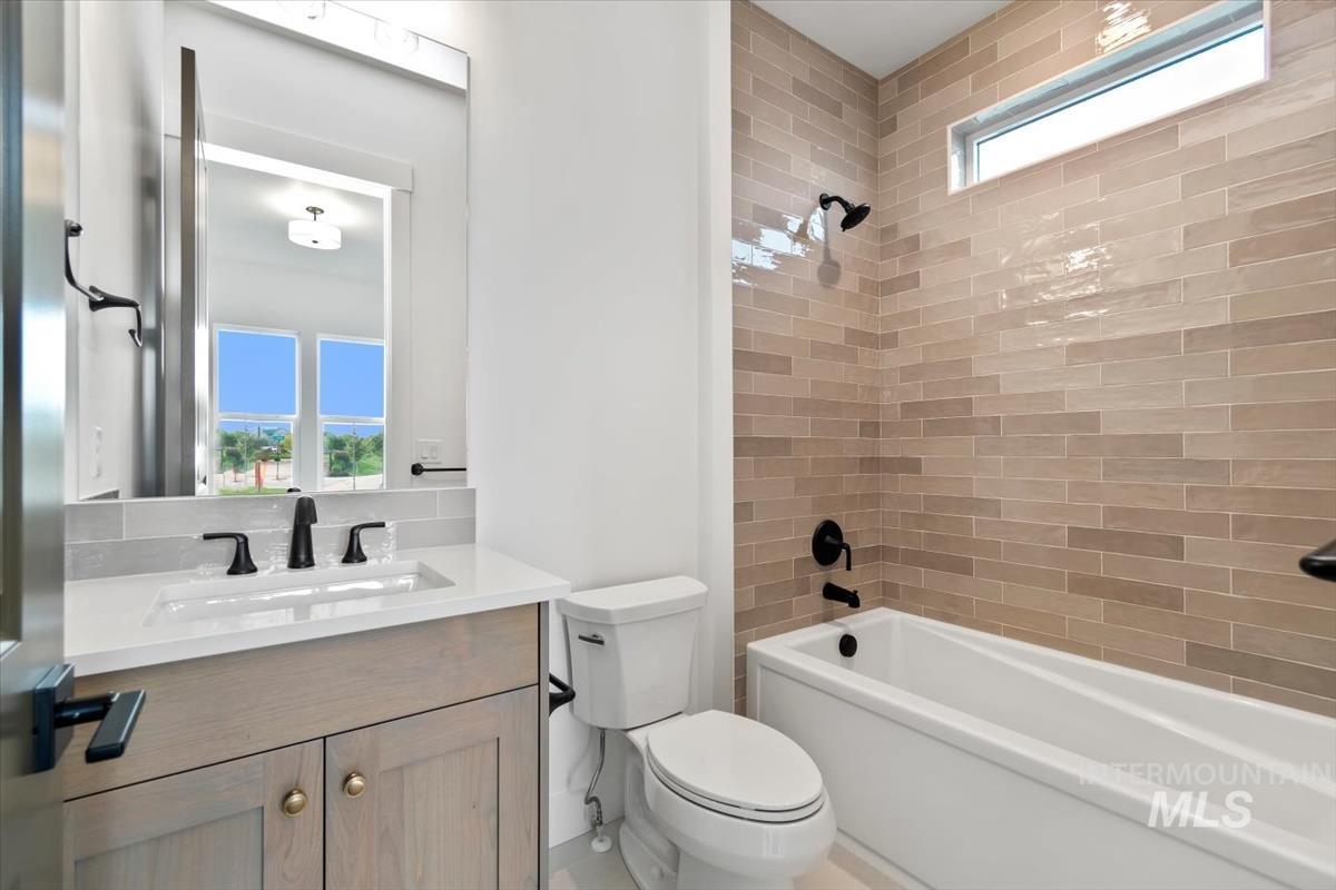 Full bathroom featuring bathing tub / shower combination and vanity
