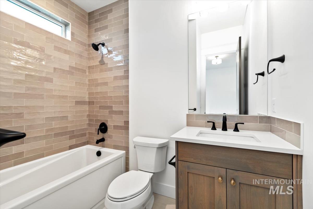 Full bathroom featuring shower / washtub combination and vanity