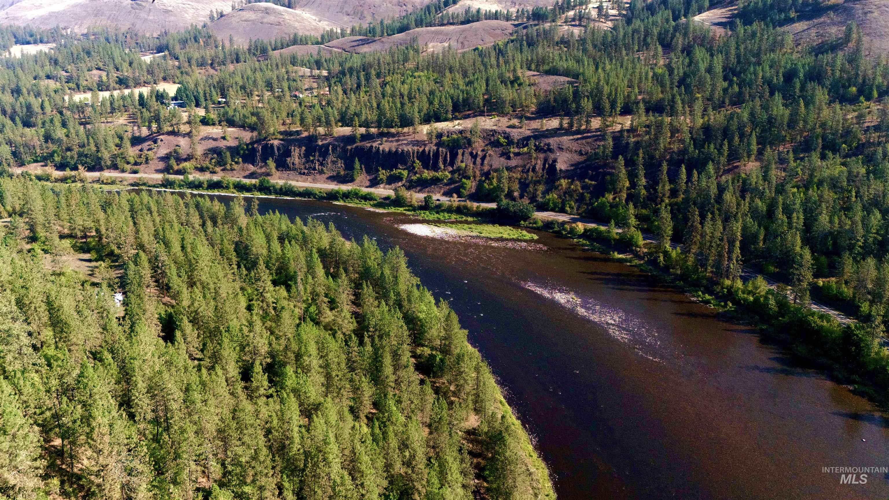 Aerial view of property's location with a water and mountain view