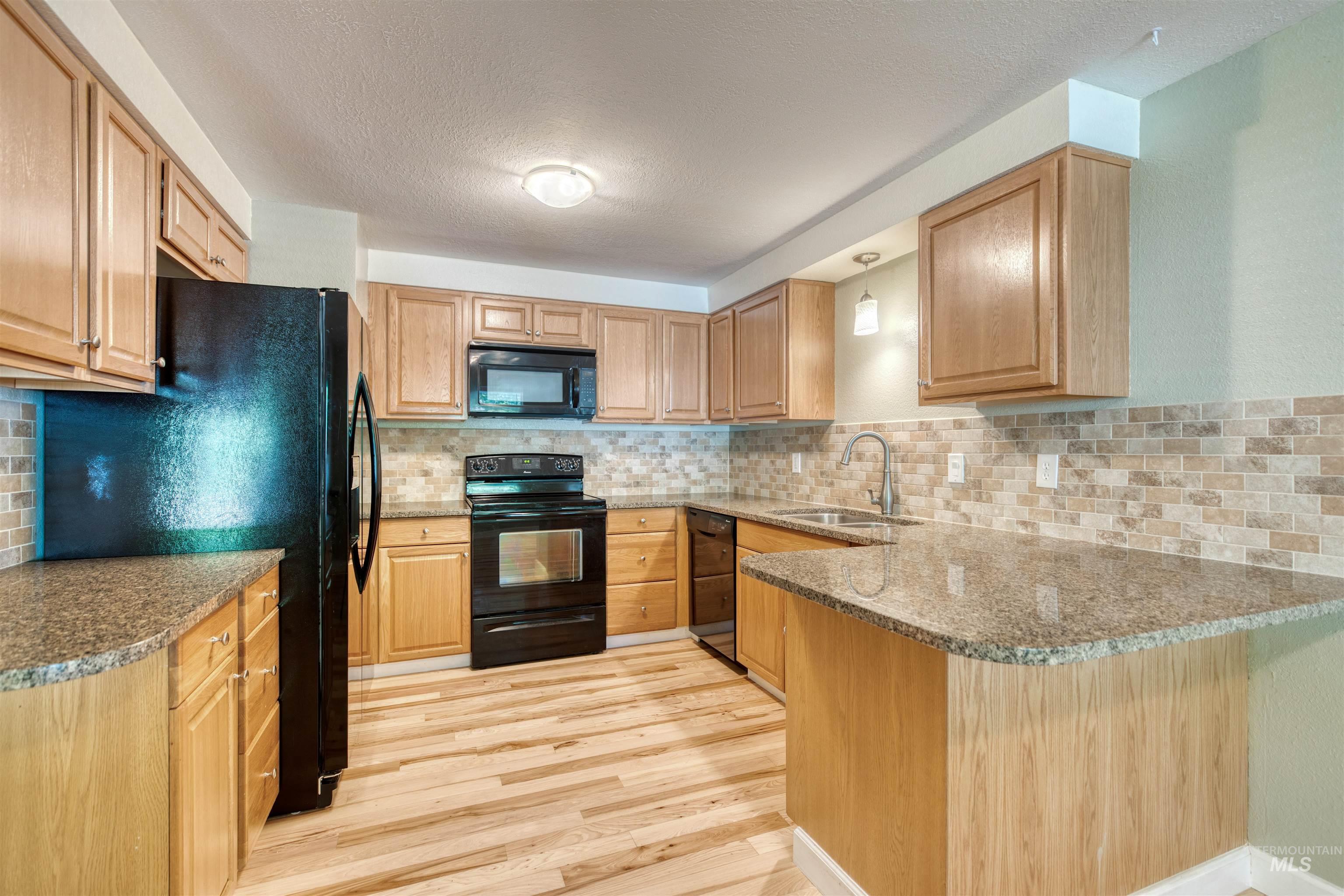 Nicely updated kitchen with eat in area and quality surfaces