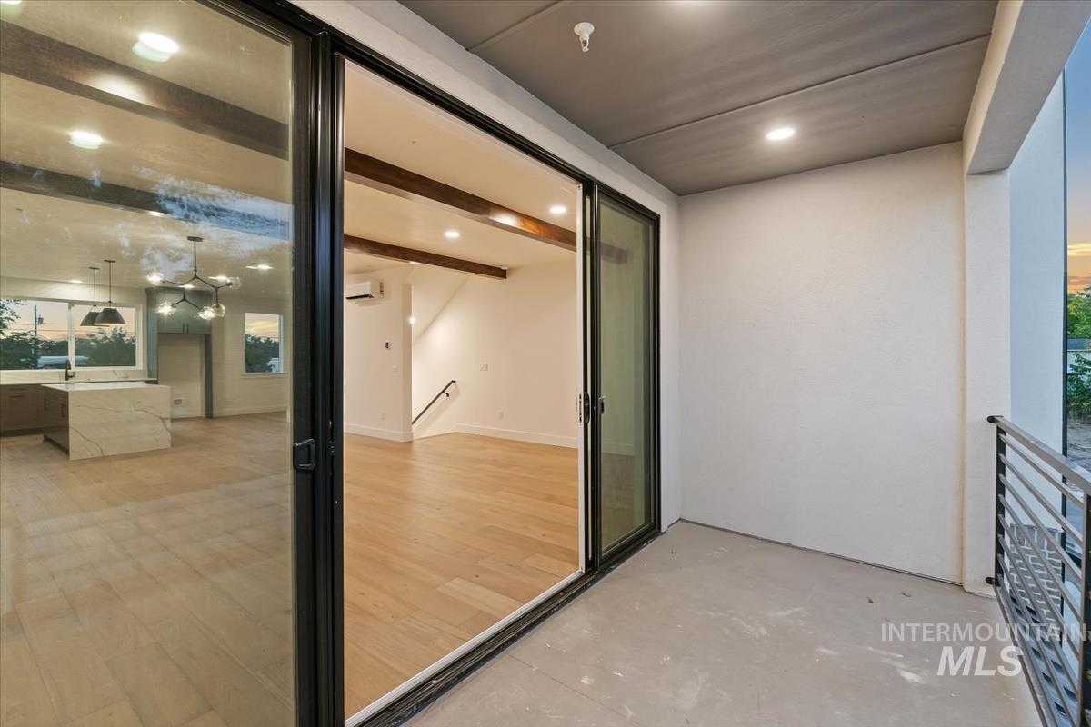 Balcony featuring a wall mounted air conditioner