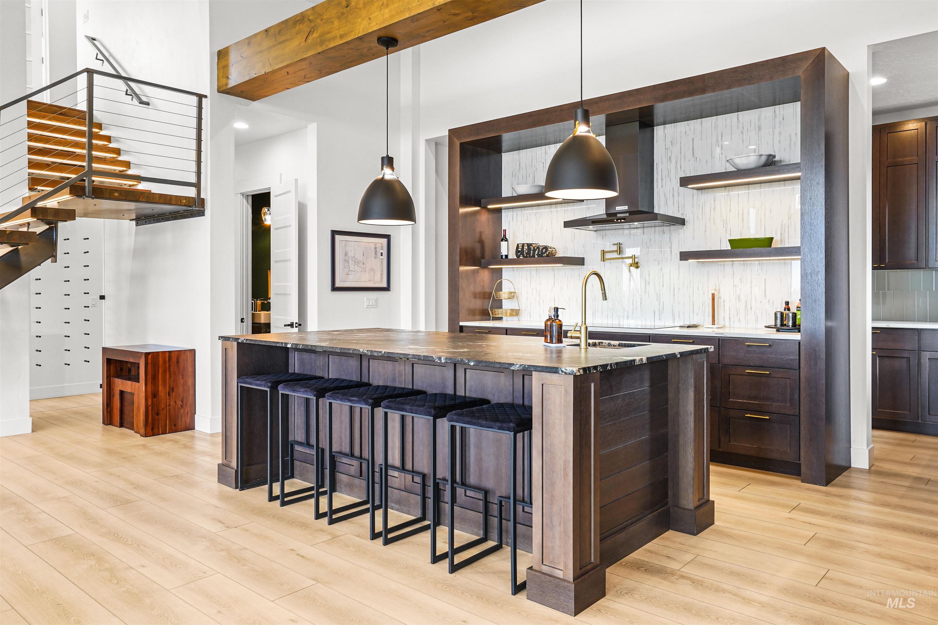 Bar featuring stairs, open shelves, dark brown cabinetry, decorative backsplash, and recessed lighting