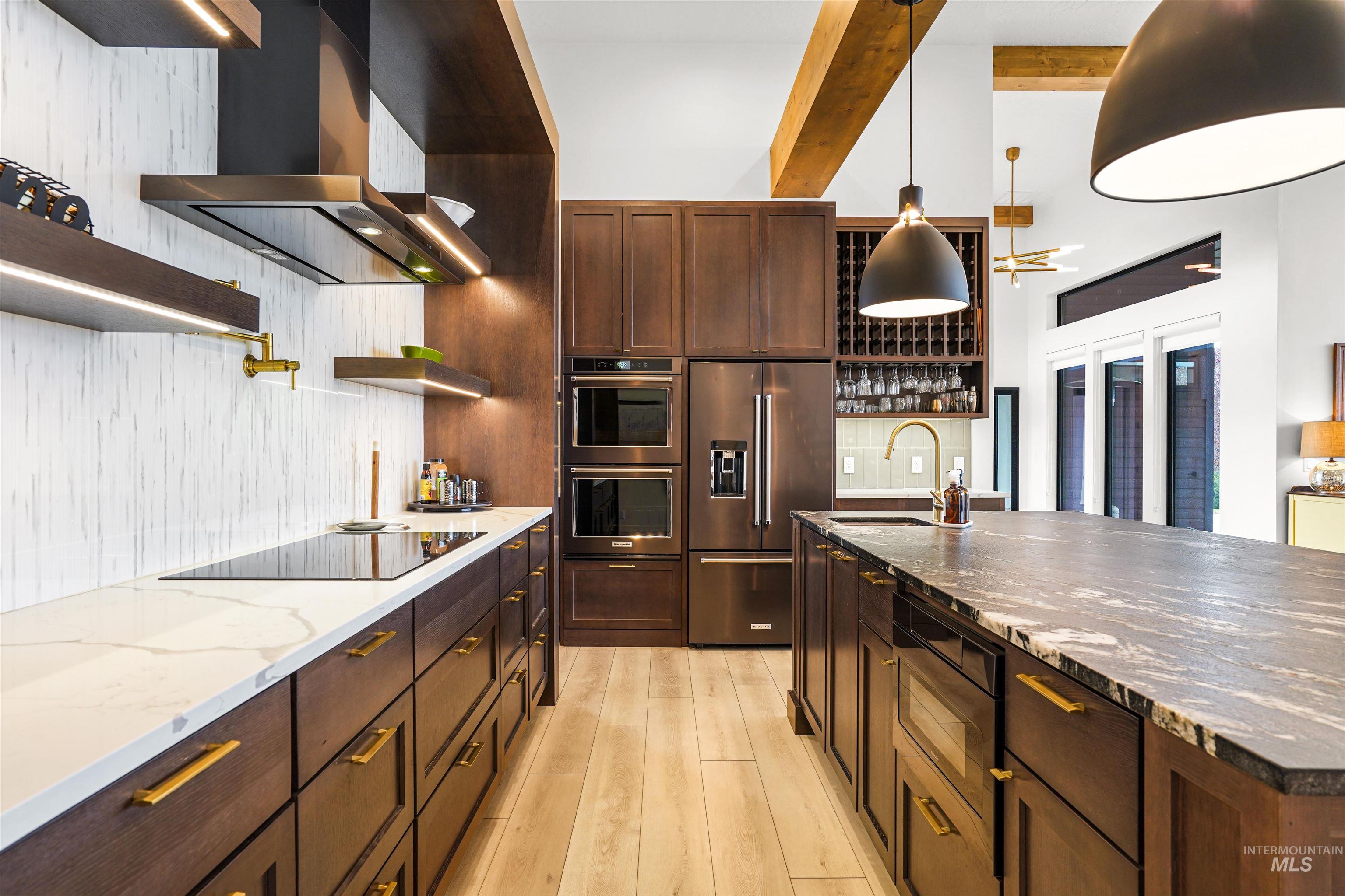 Kitchen featuring open shelves, wall chimney exhaust hood, dark stone countertops, black appliances, and dark brown cabinetry