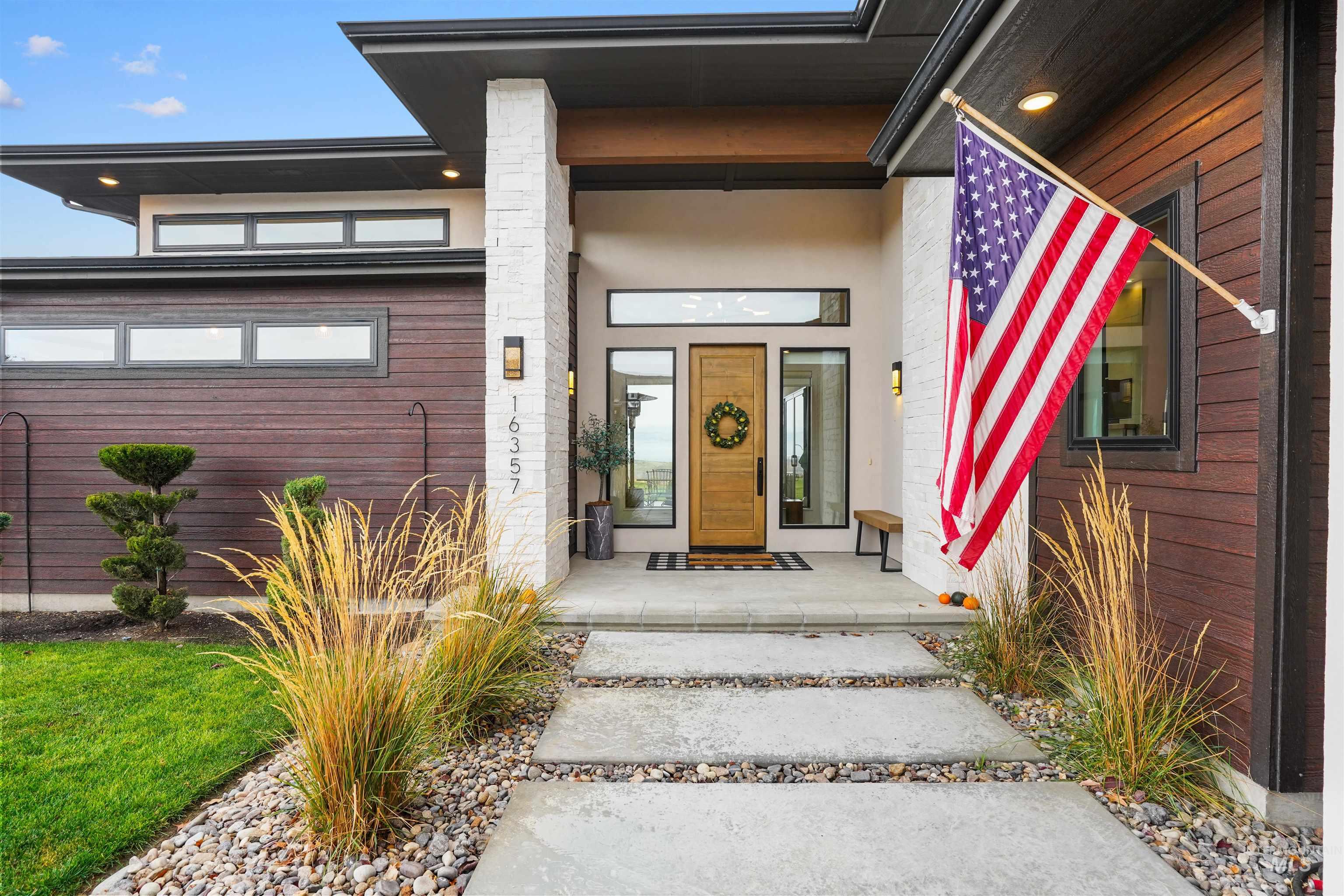Doorway to property featuring a porch