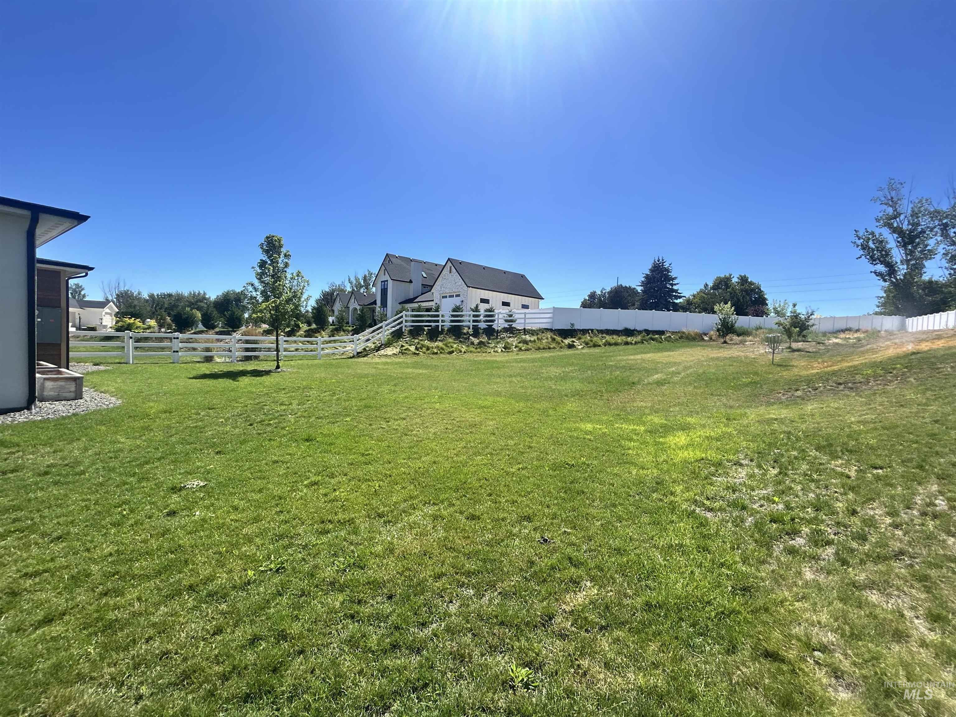 View of fenced backyard