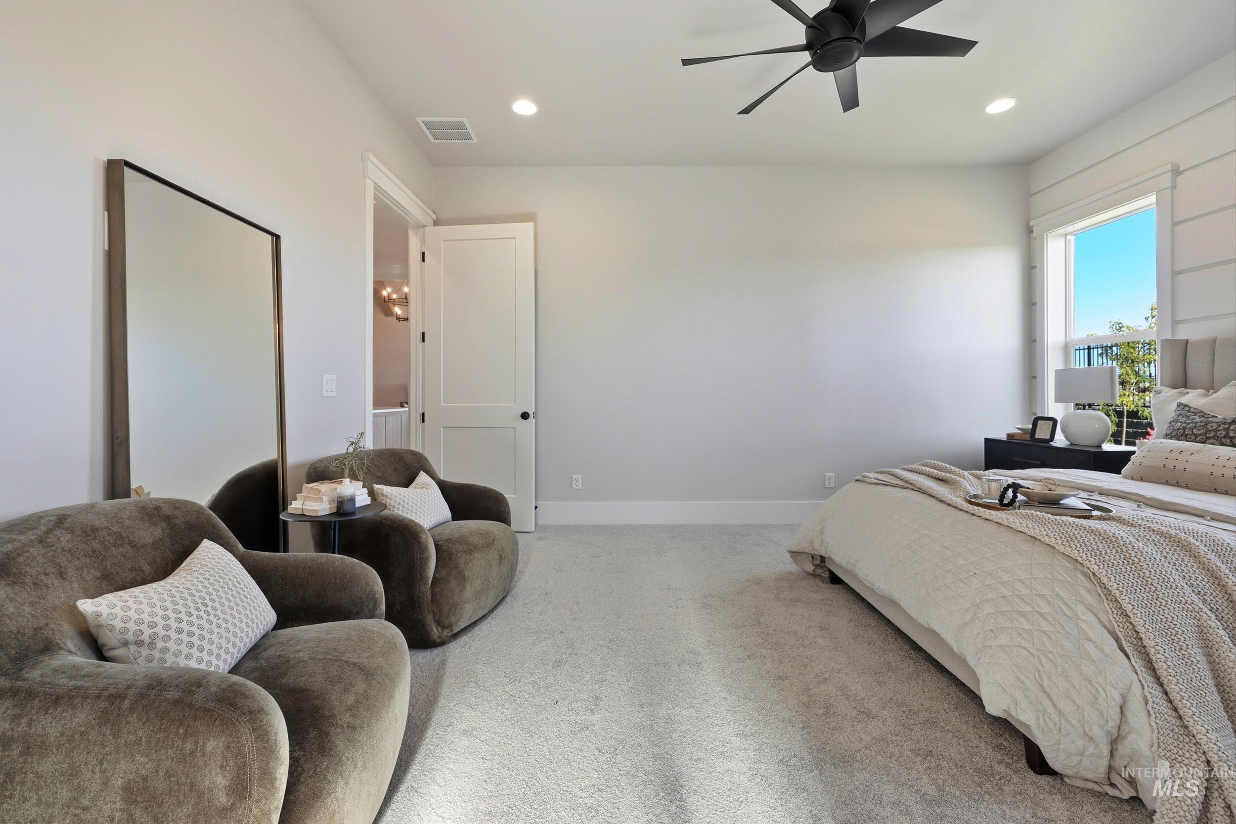 Carpeted bedroom featuring recessed lighting and ceiling fan