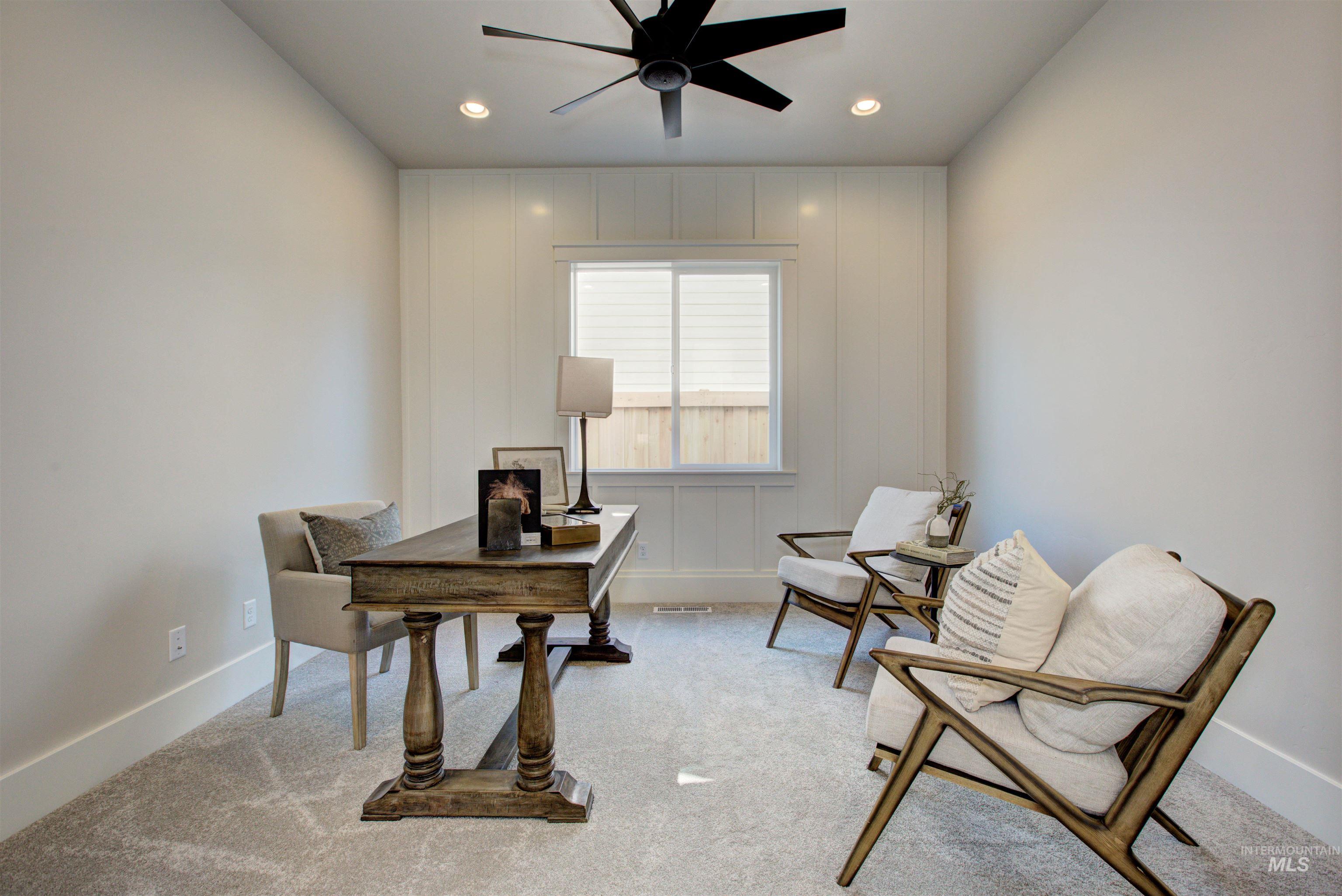 Office featuring light colored carpet, a ceiling fan, and recessed lighting
