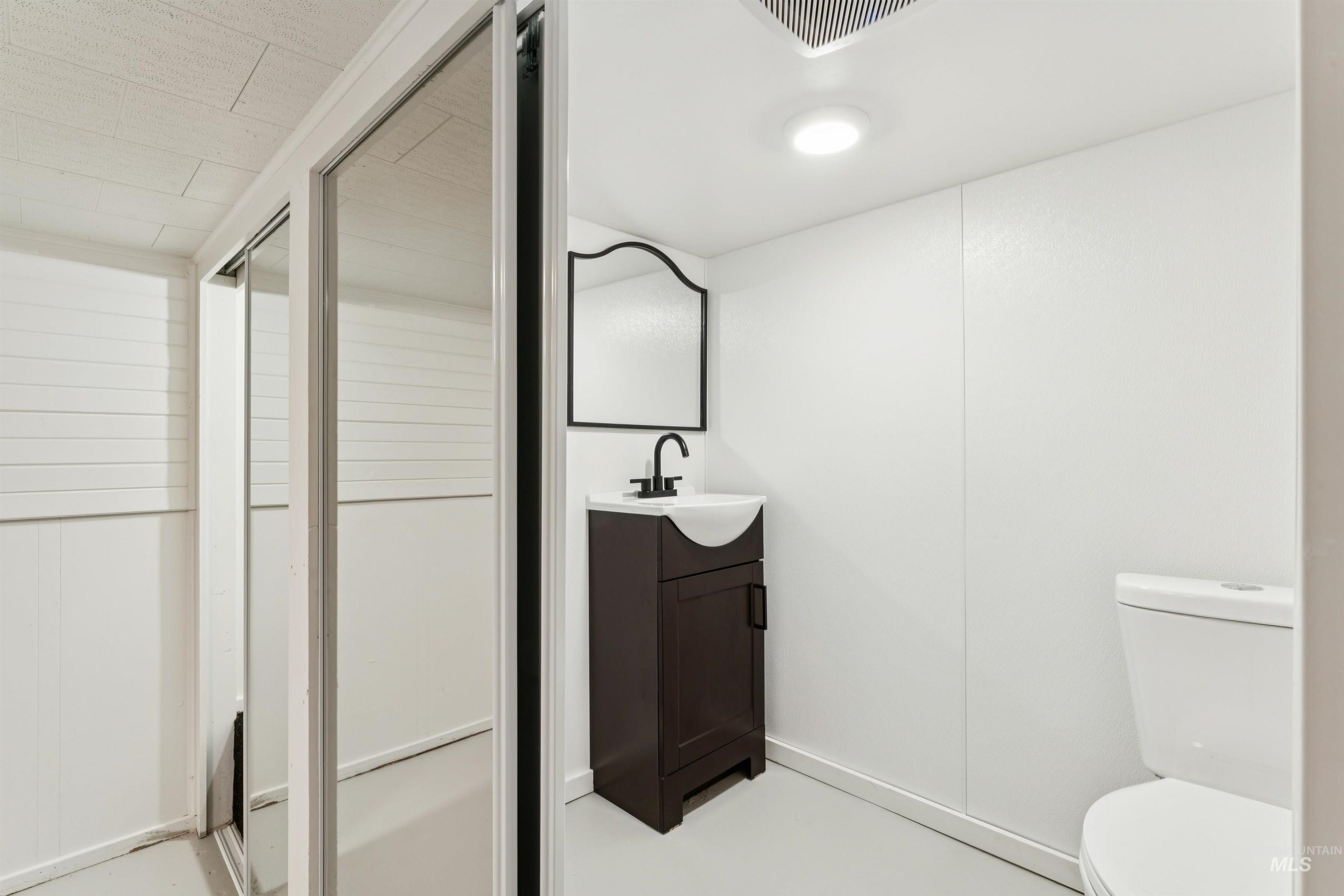Bathroom with vanity and toilet