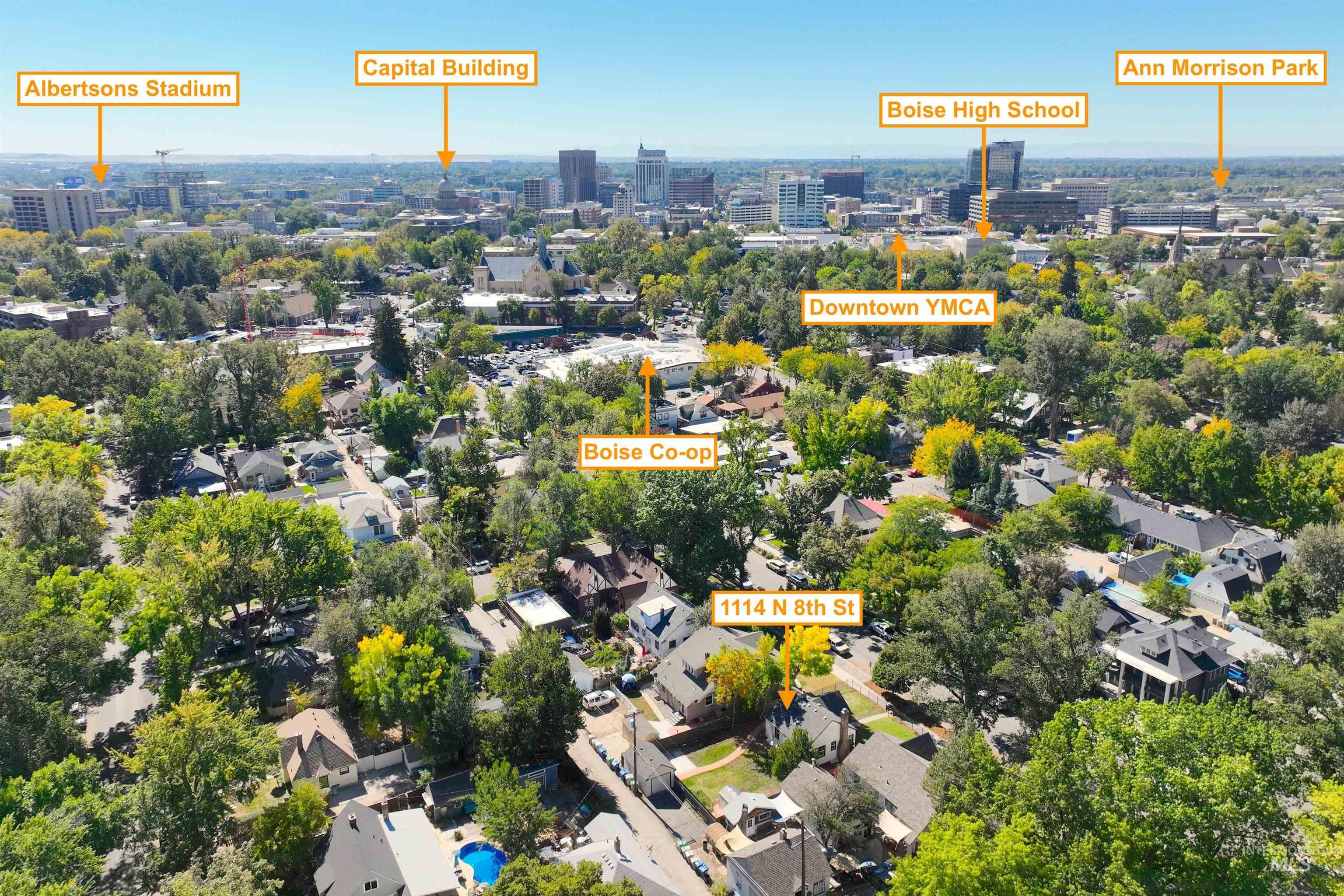Aerial overview of property's location with nearby urban area
