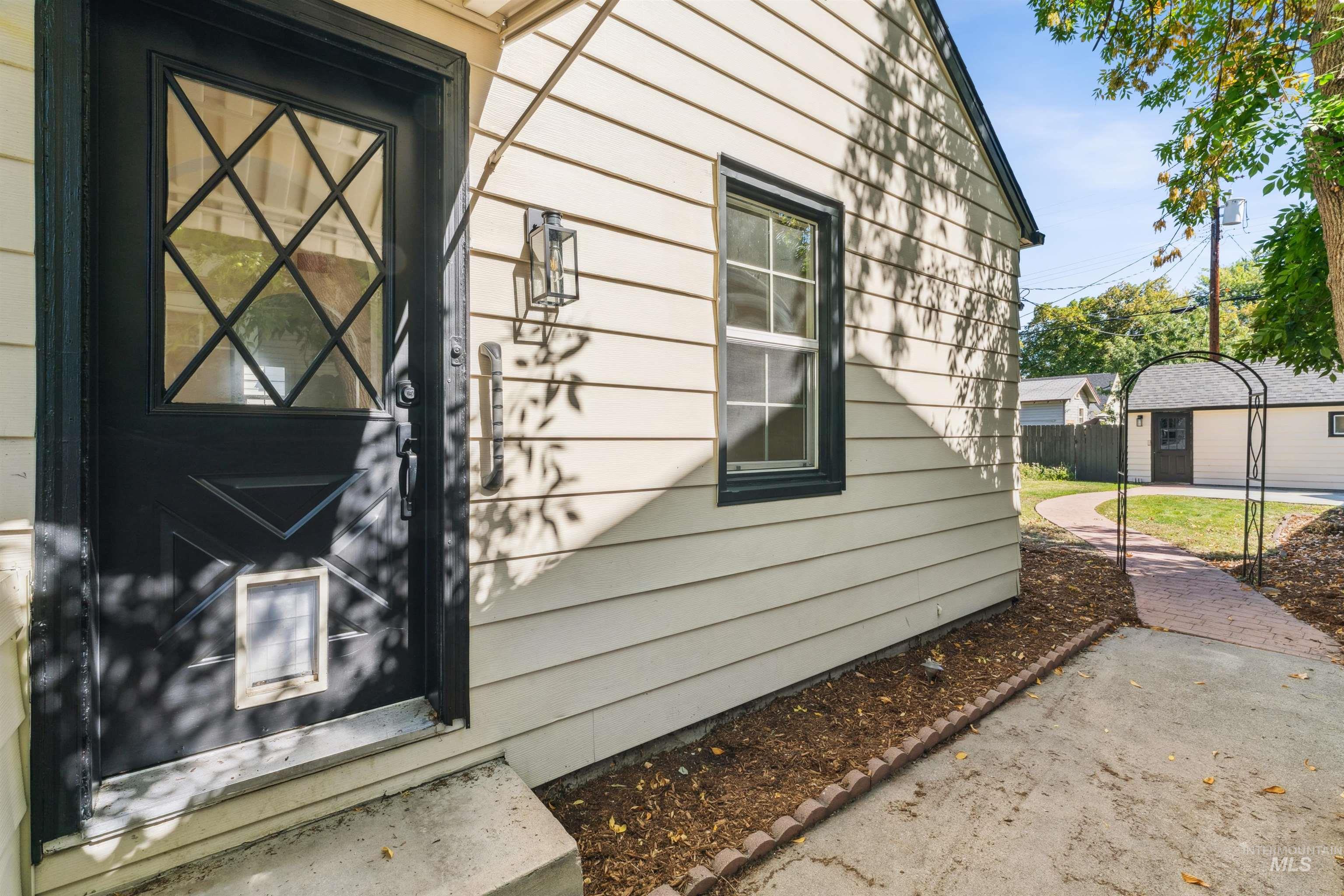 View of home's exterior with an outdoor structure
