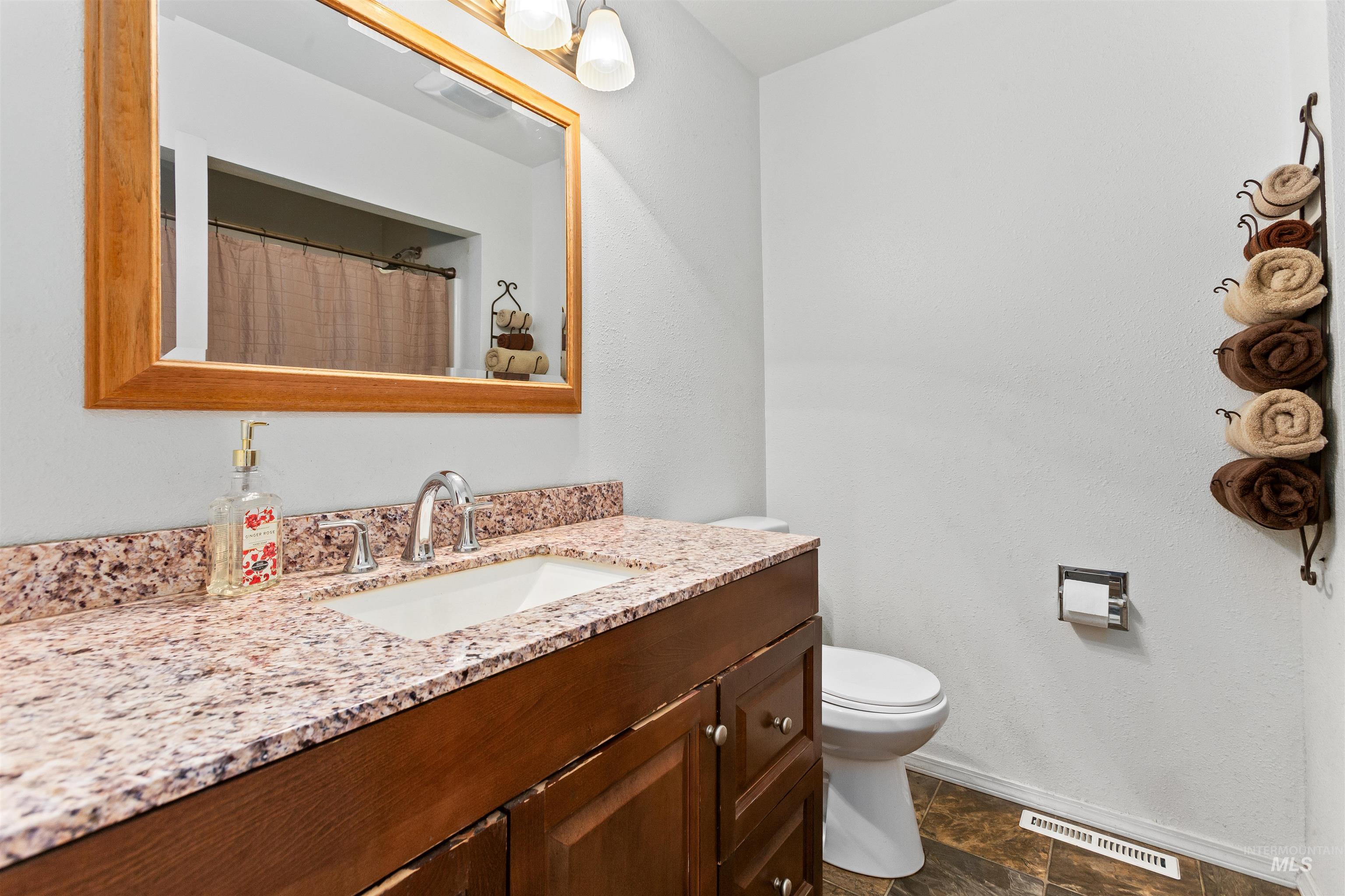 Bathroom with vanity and a shower with curtain
