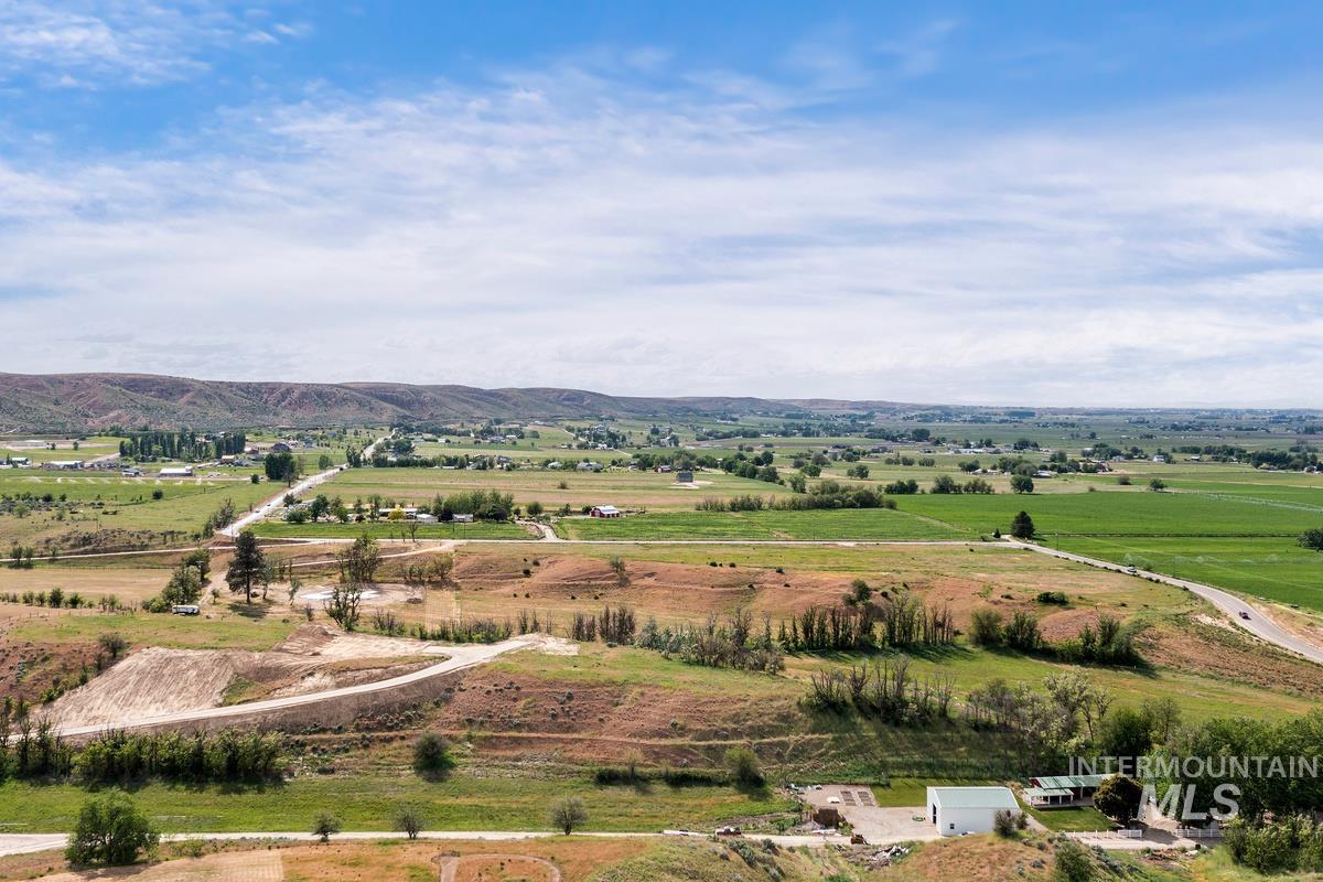 Aerial view of sparsely populated area with a mountainous background