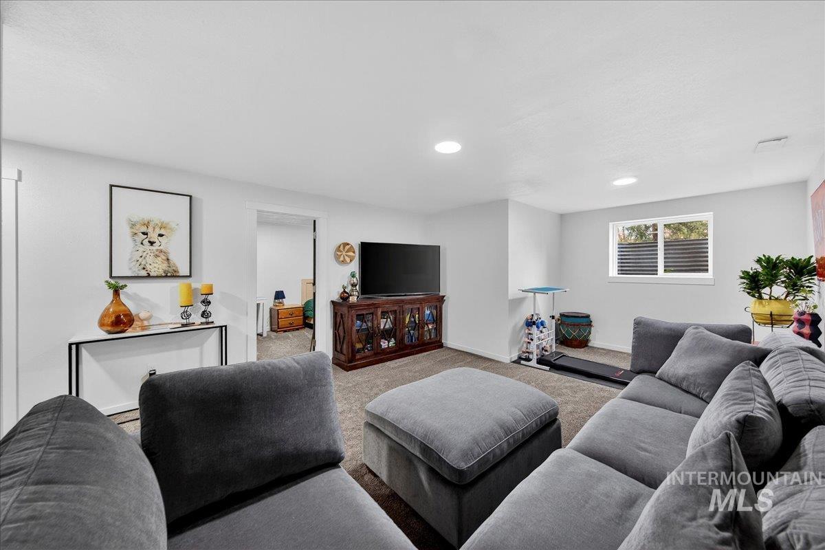 Living room featuring carpet and recessed lighting