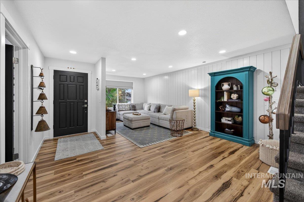 Entryway with light wood-type flooring and recessed lighting