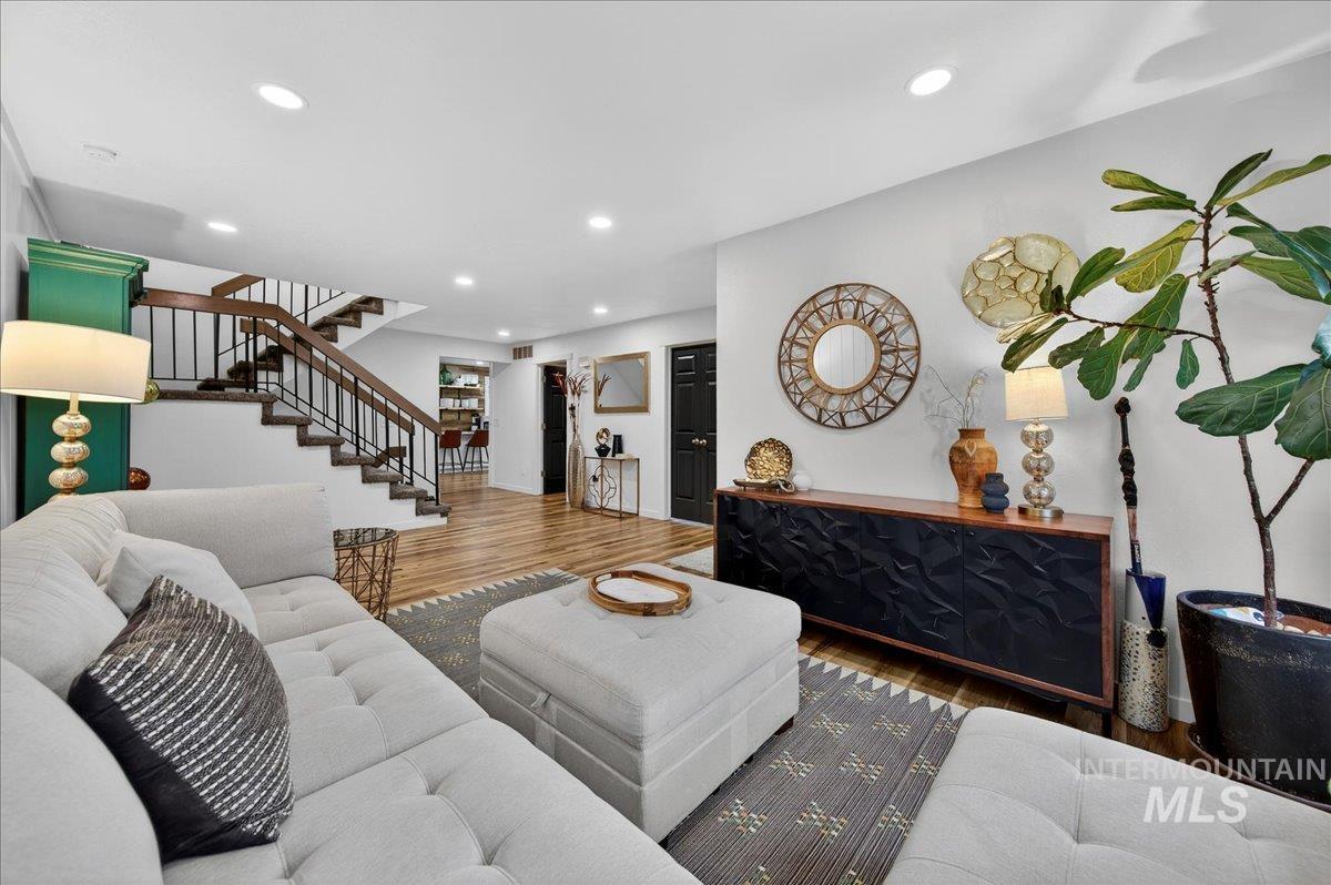 Living area featuring wood finished floors and recessed lighting