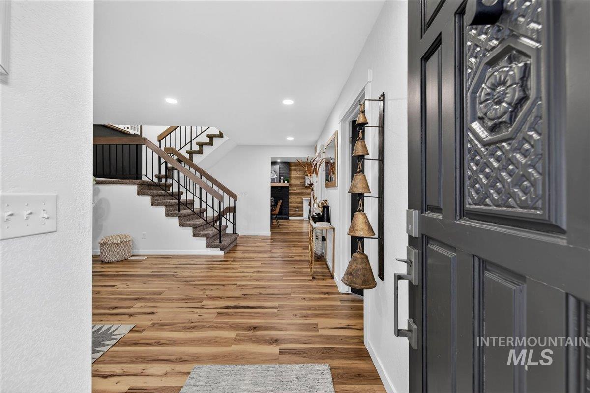 Entryway featuring light wood finished floors and recessed lighting